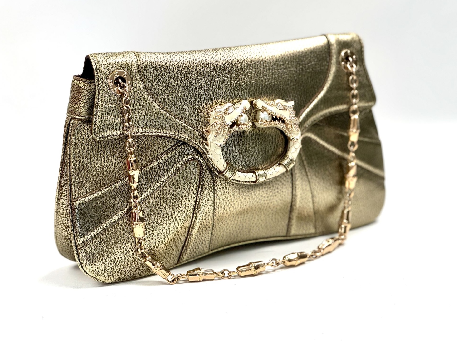 Going, going, gone Pick up a designer bargain and help raise funds for the British Heart Foundation in the process via their designer auction with eBay. Lots include a Tom Ford-era Gucci gold bag with dragon-head clasp, Prada cherry-red slingbacks and Balenciaga speed sneakers. Bidding close at 9pm on 27 July,  eBay