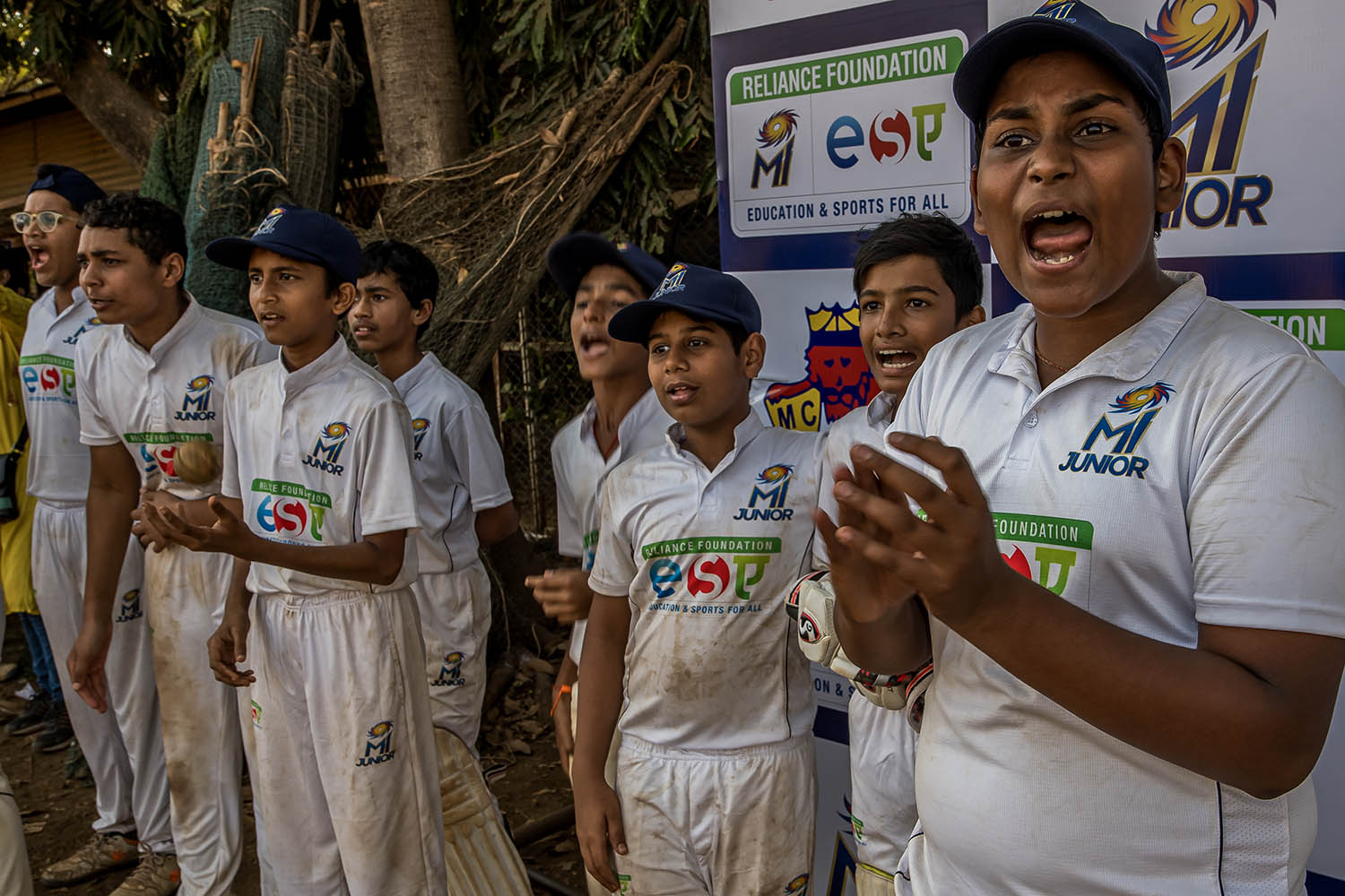 Junior players cheer on their team in an inter-schools tournament on the Azad Maiden sports ground in Mumbai