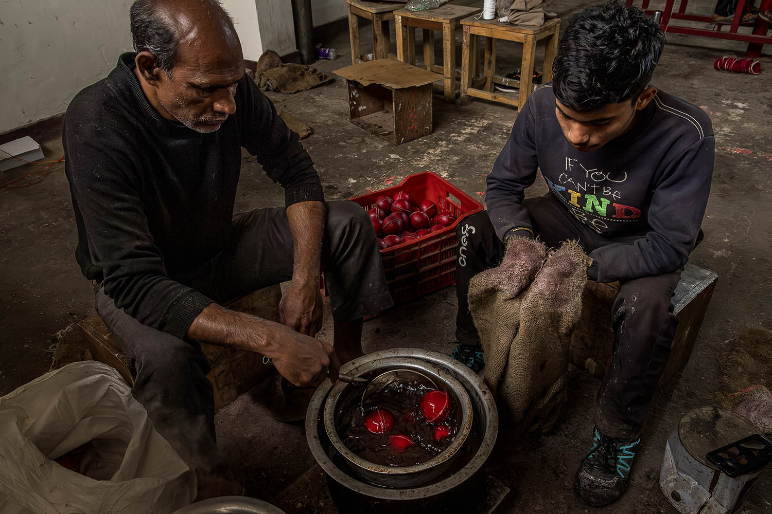 At the Mark Divine workshop in Meerut, balls are dipped in heated wax to protect against water damage