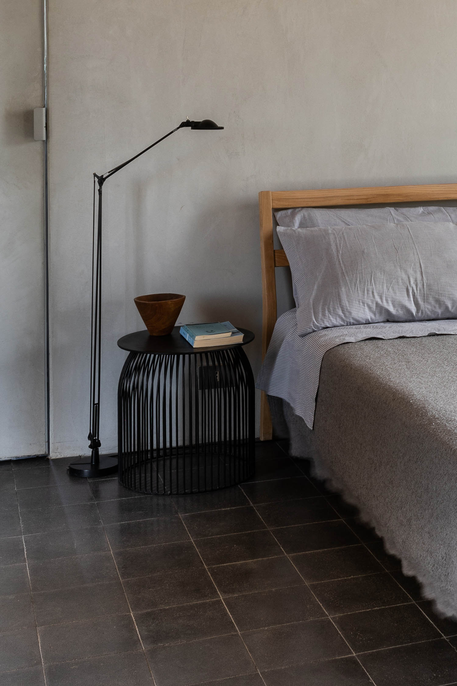 ‘We tried to maintain the building’s original patina’: stone tiles keep the bedroom cool