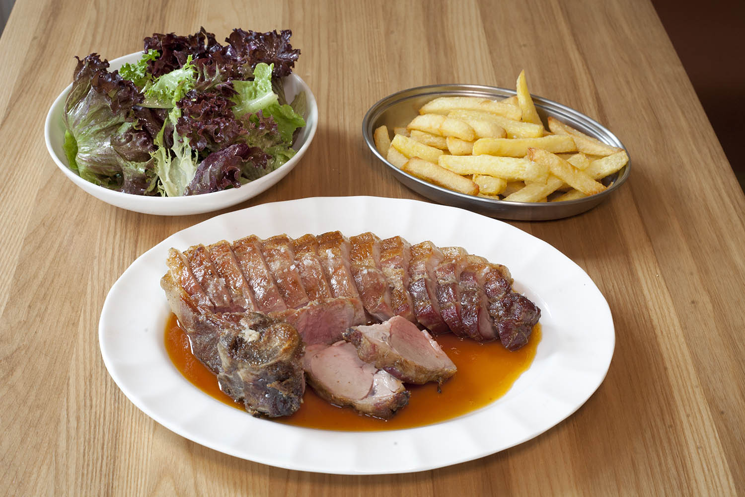 ‘Wantonly succulent’: pork chop with apricot juice, green salad and chips