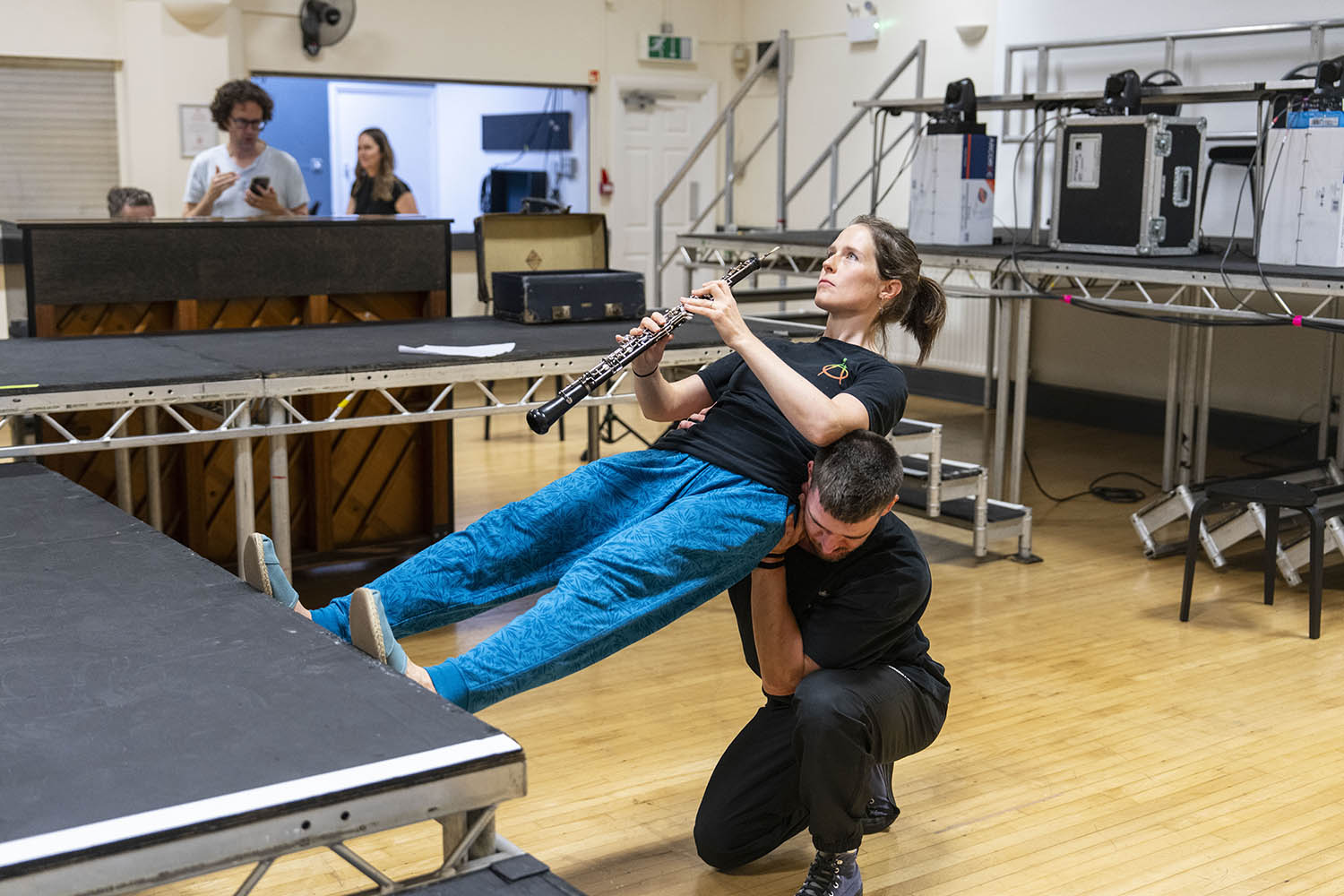 Oboist Katie Bennington is lifted on to a stage