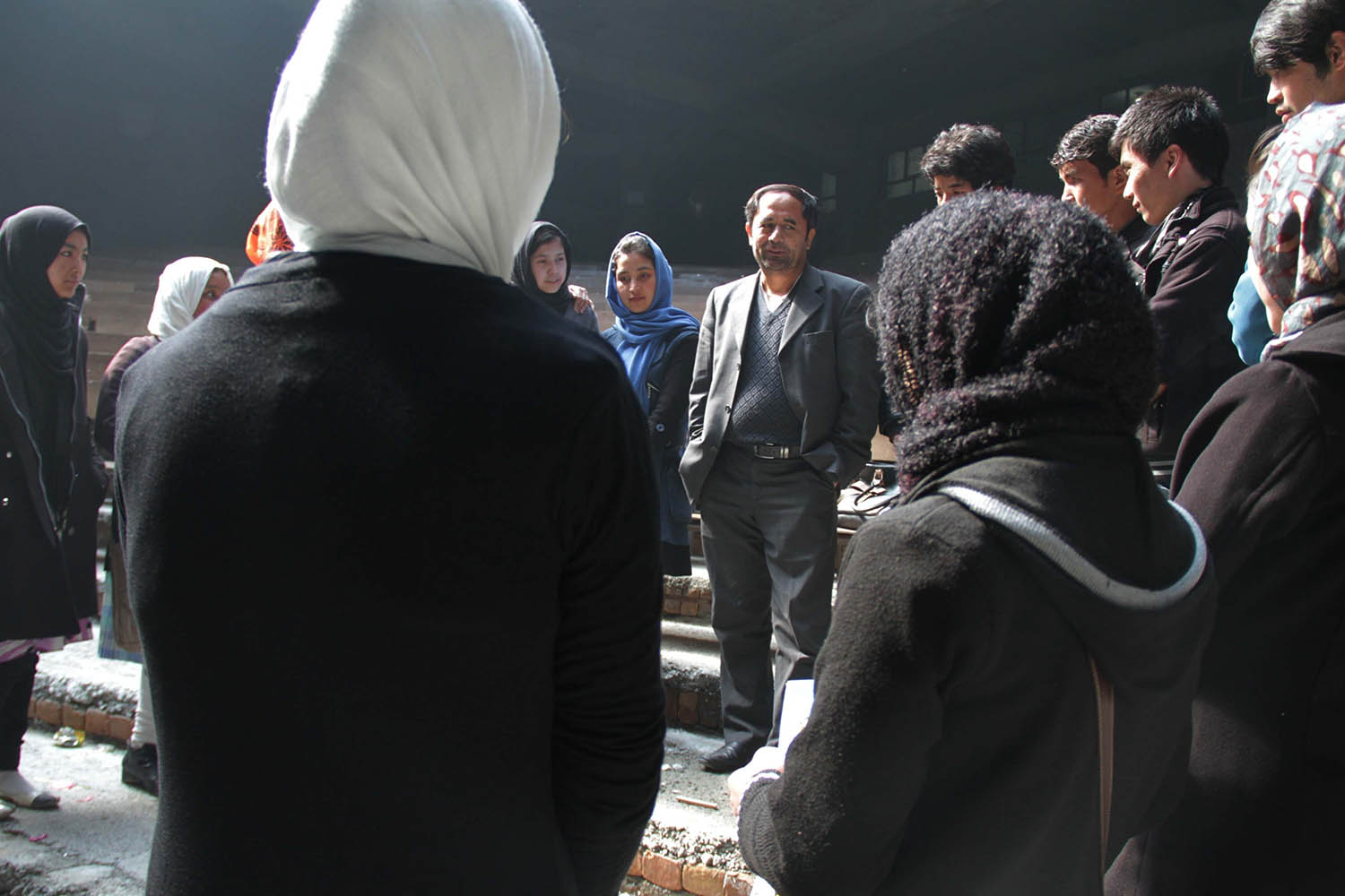 Aziz Royesh talking to pupils at his school