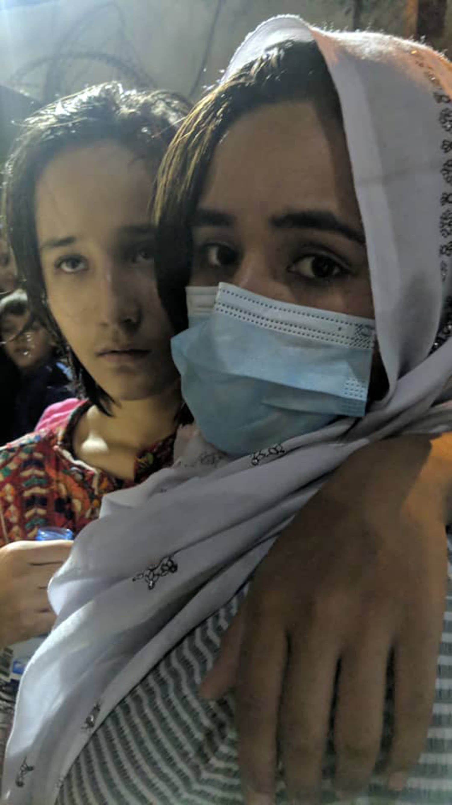 Headteacher Aziz Royesh’s daughters at Kabul airport in August 2021