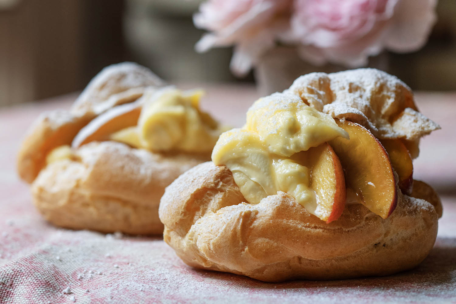 Choux buns filled with peaches and cream