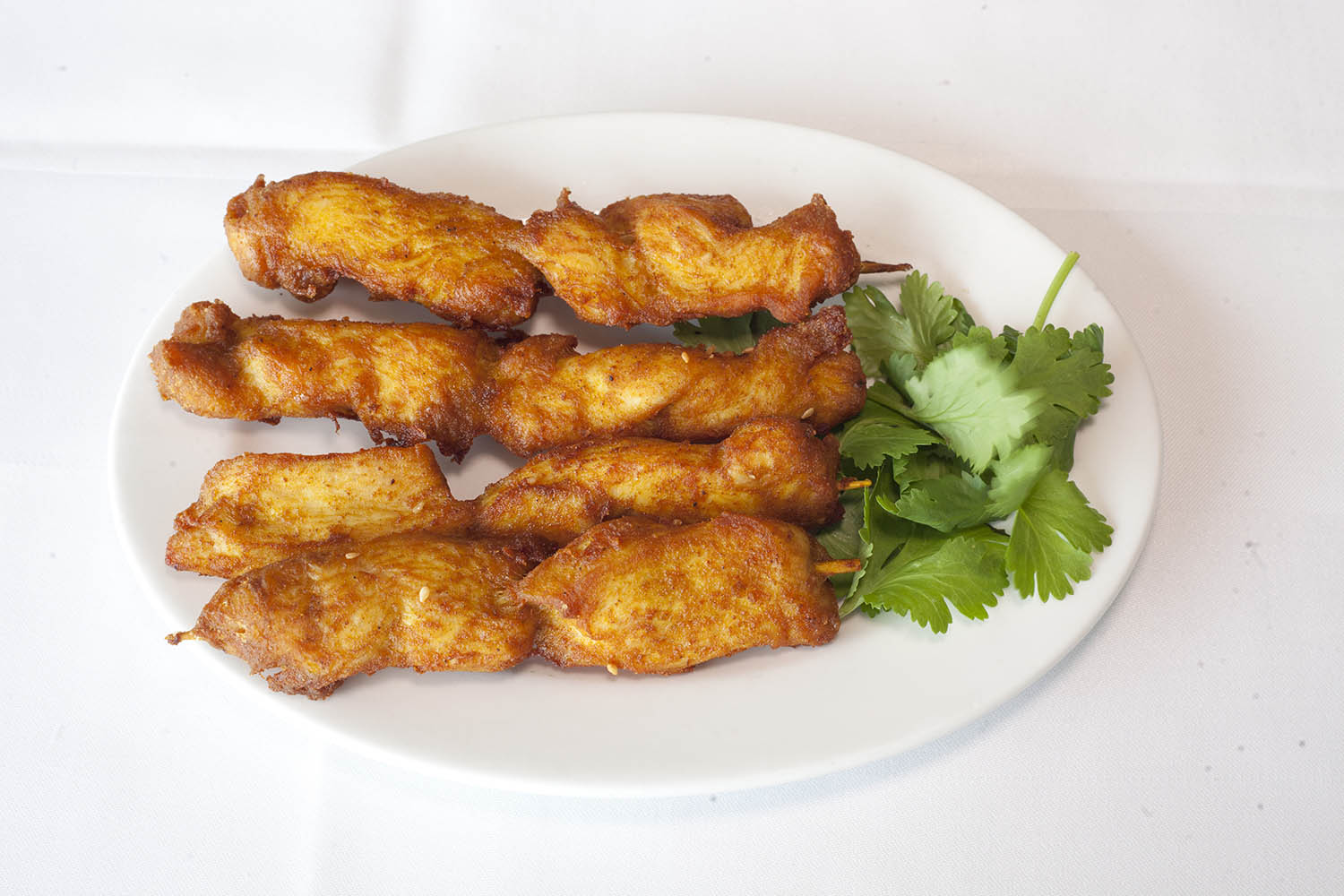 ‘You tick off dishes like you’re ordering at Argos’:chicken satay skewer