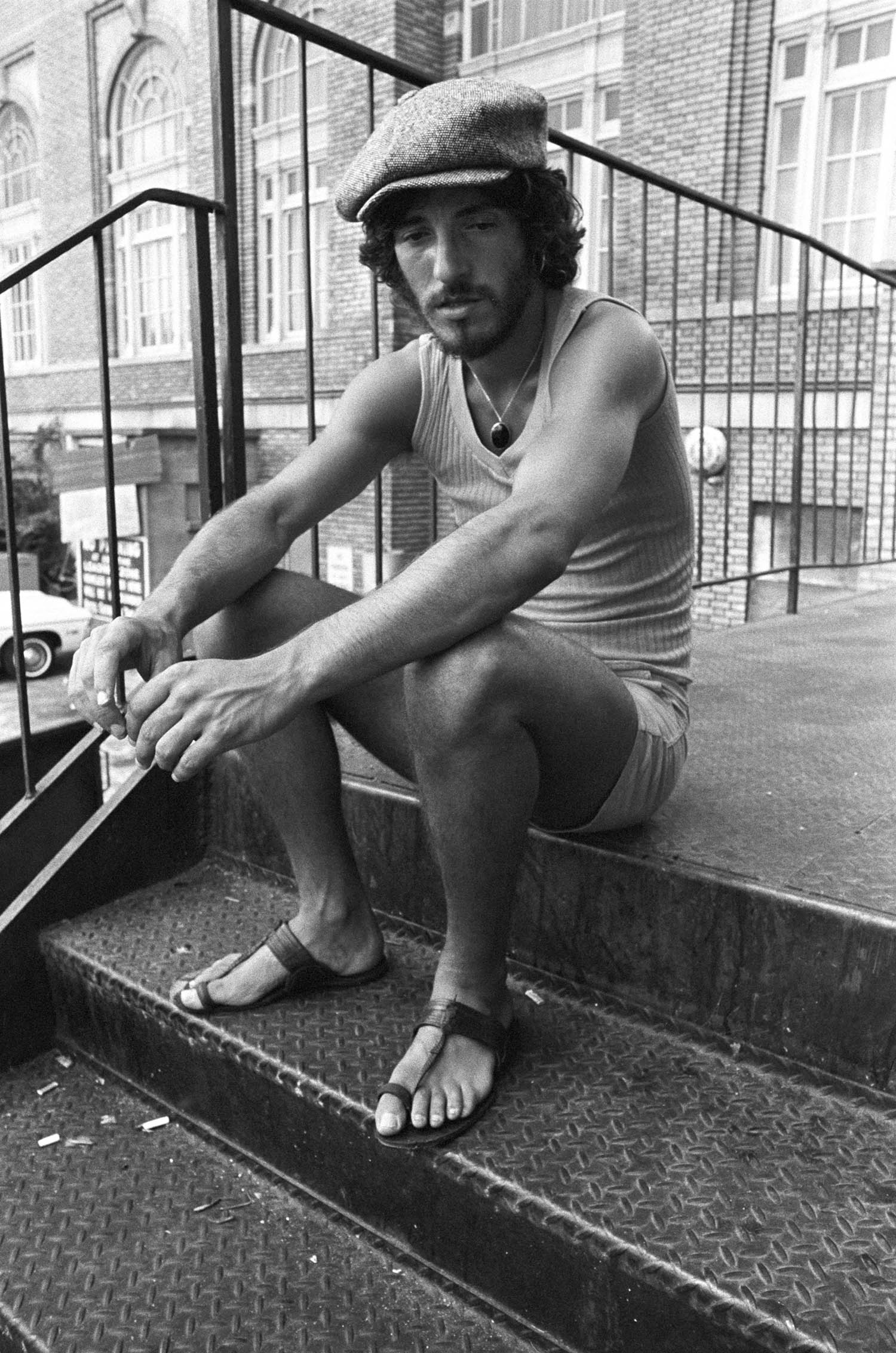 Bruce Springsteen takes a break from soundchecking during the Born to Run tour in Atlanta, 1975