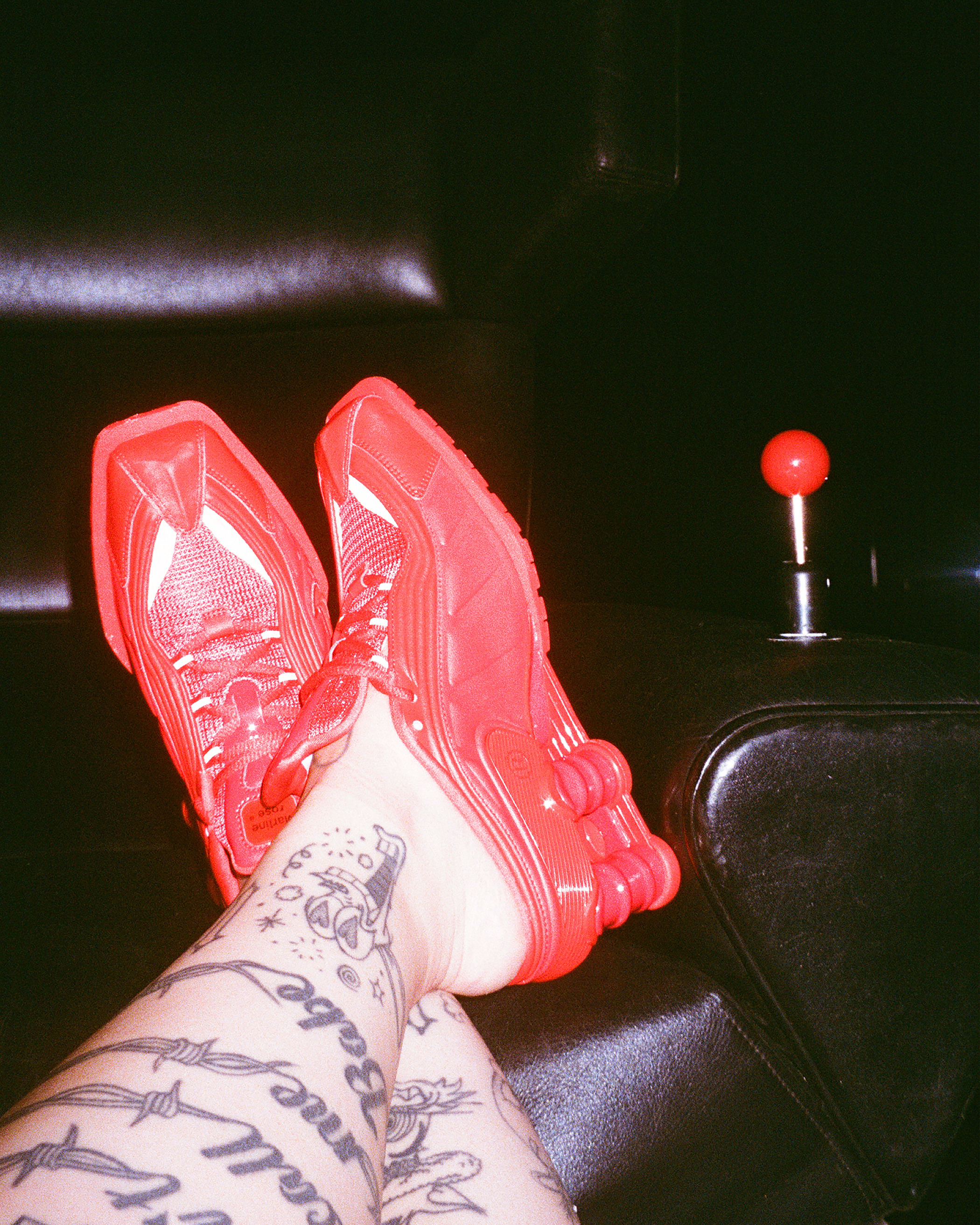 Striking footwear: Martine Rose has a rich history of merging football culture into her designs. For USA/Canada/Mexico 26 she teams up with Nike on an all-red, squared-toe take on the Shox R4 trainer. (Fun fact: Kendrick Lamar wore Rose’s football boot/dress shoe hybrid to the 2023 Grammy’s). £185, Martine Rose
