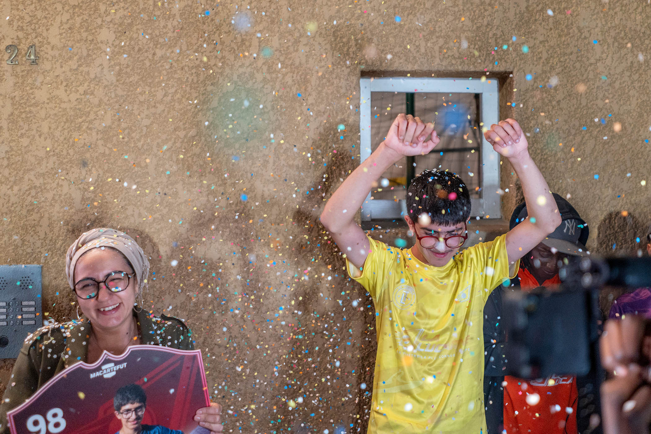 French football’s new boy-hero Ismaël, 13, celebrates with his mother