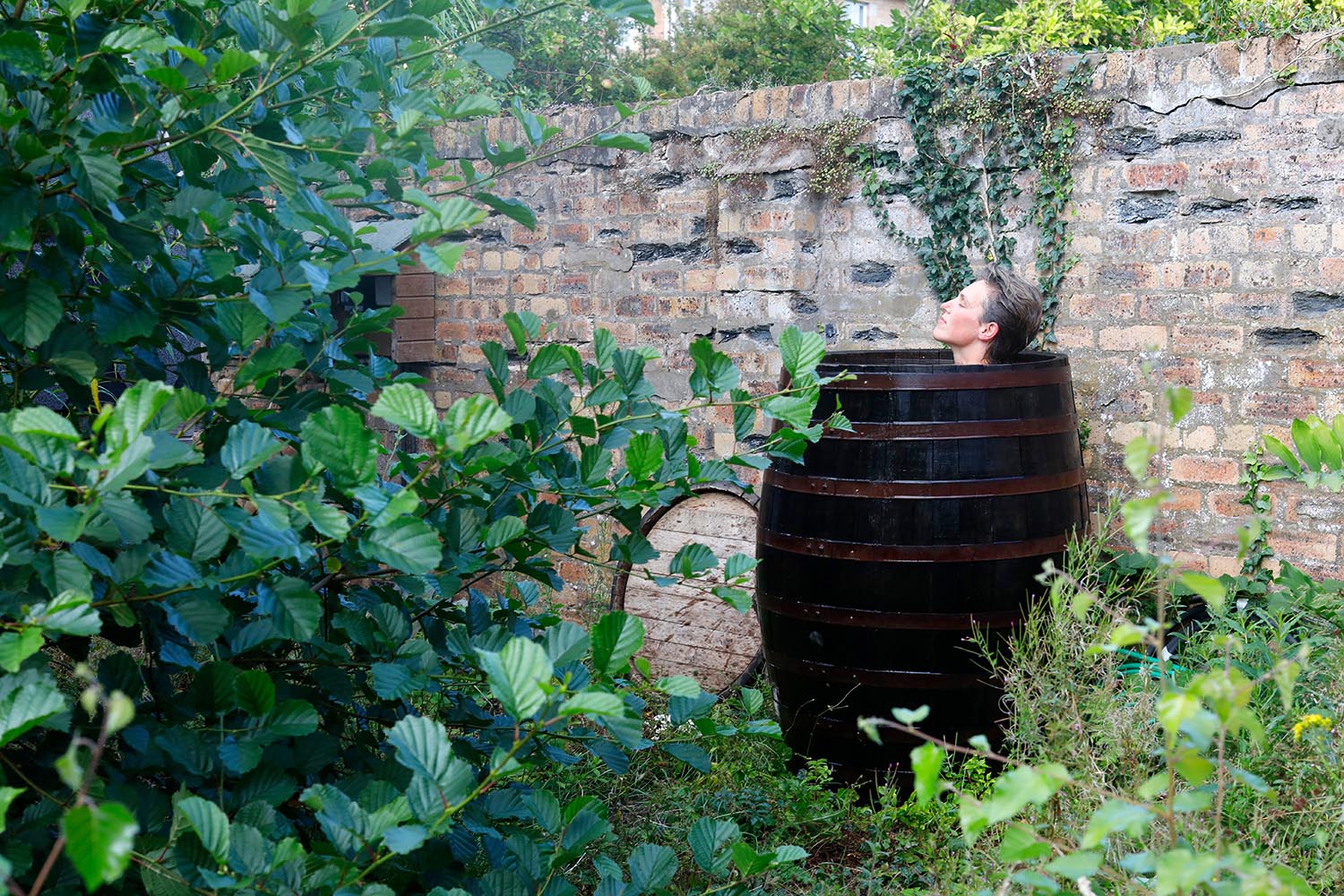 Gina Lundy takes a plunge in a whisky barrel in Glasgow