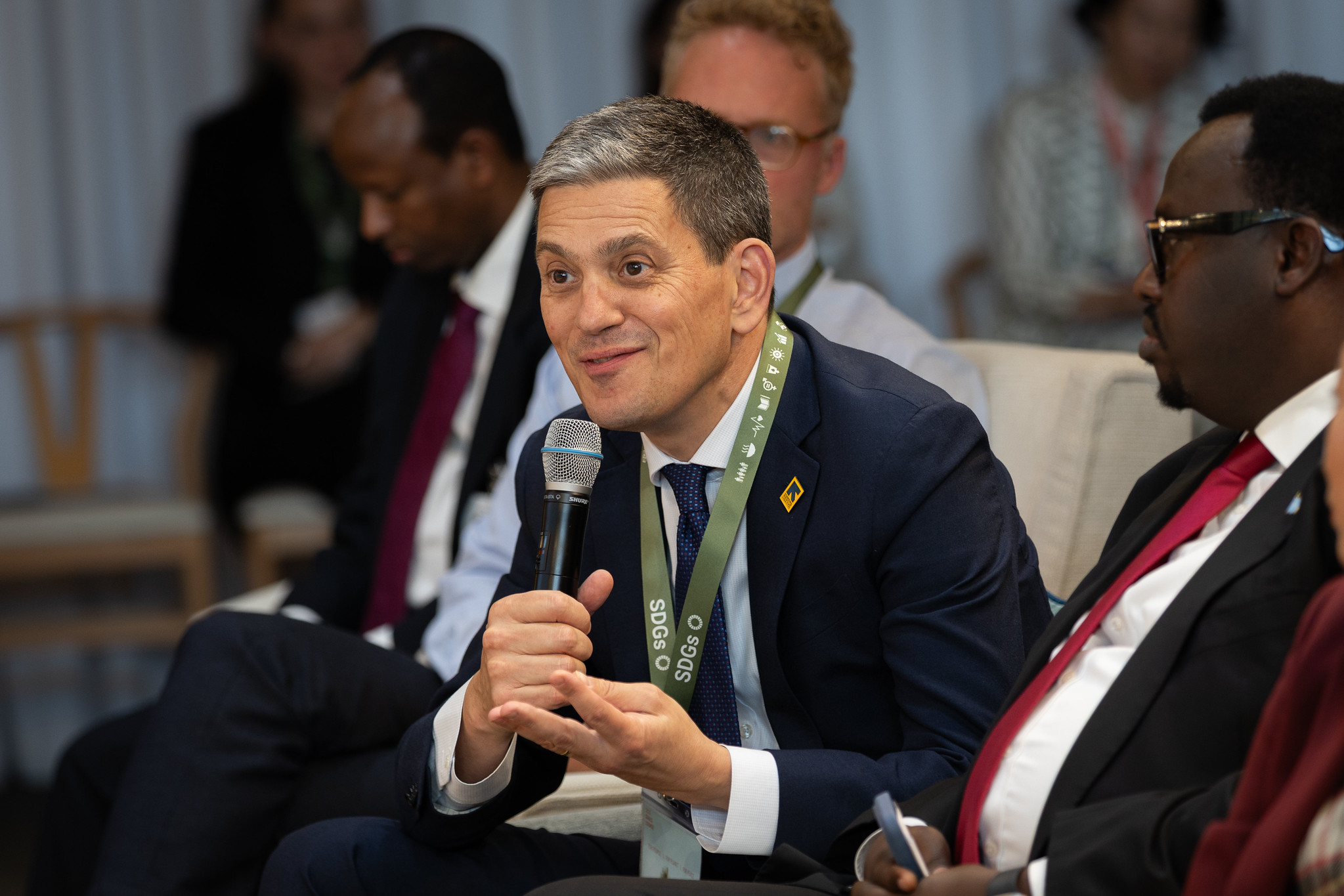David Miliband speaking into a microphone