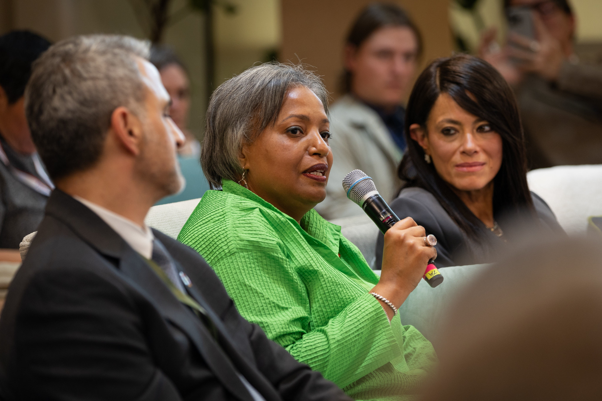 Alexia Latortue speaking into a microphone