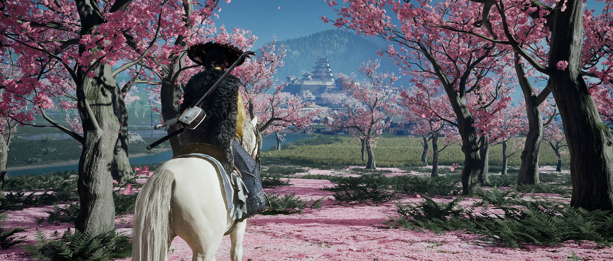 ‘Both games dwell on Japan’s changing seasons: pink blossom petals drift in spring, sunlight tinsels on a summer stream’