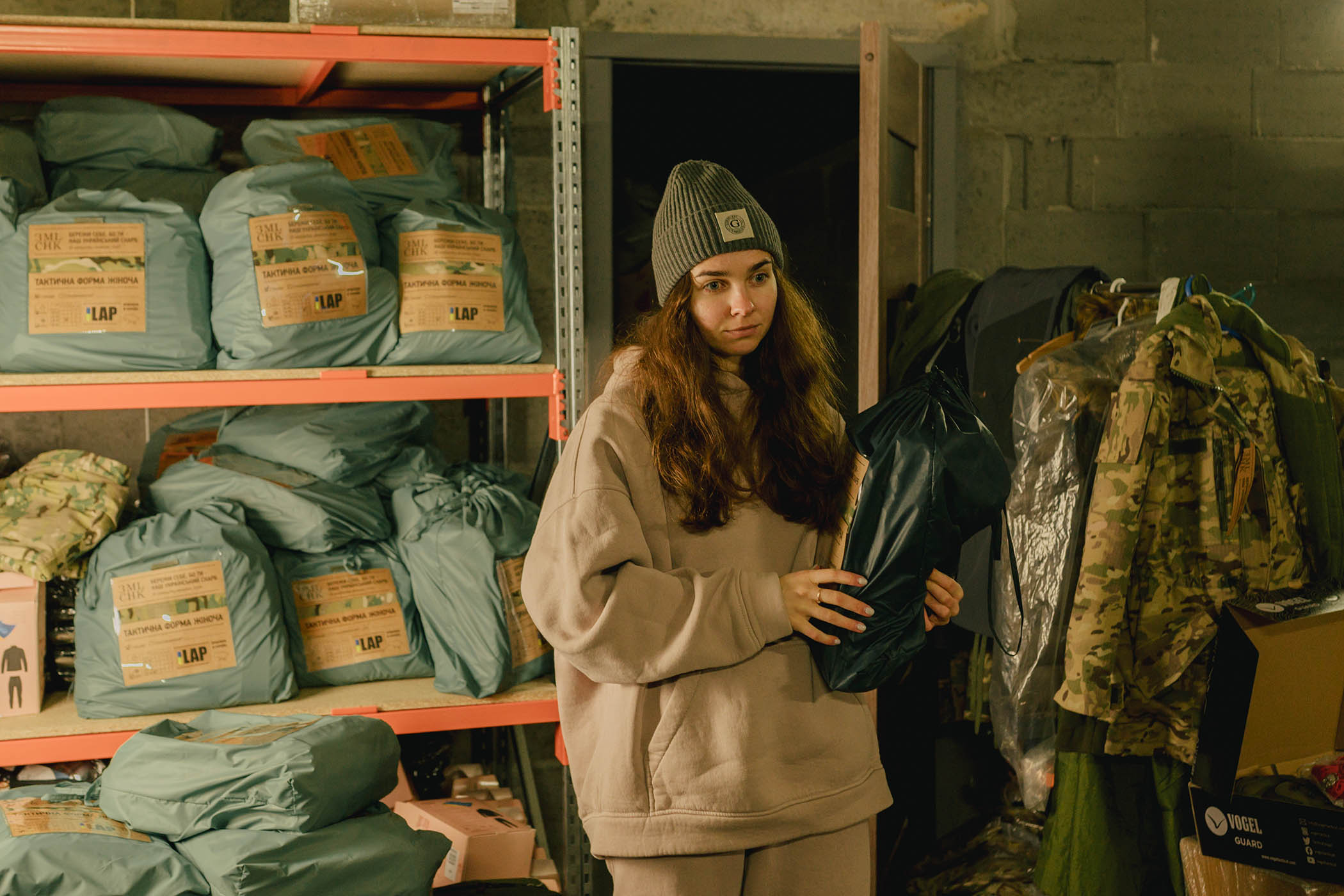 Volunteer Ksenia arranges relief supplies for the troops