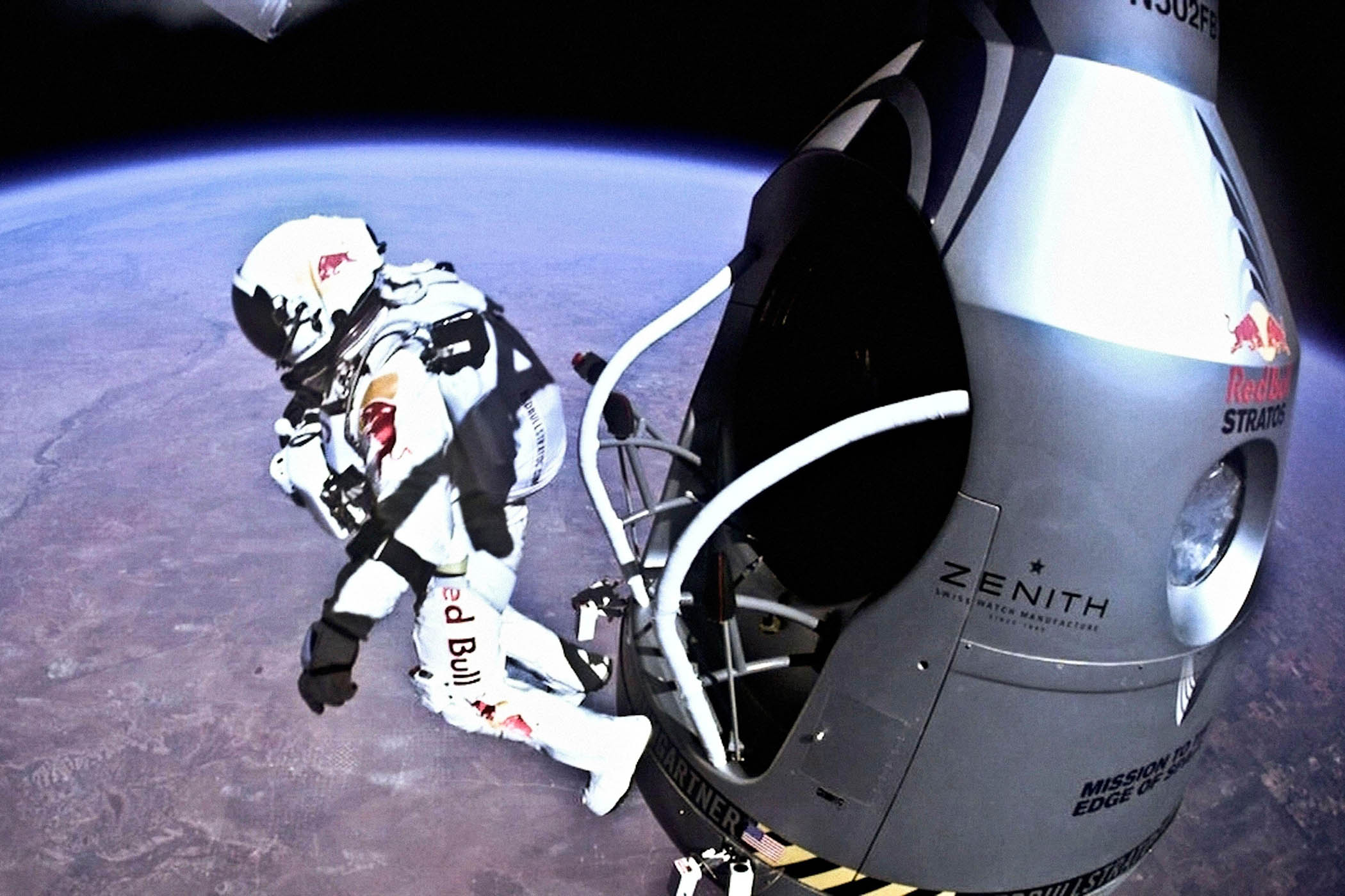 Baumgartner makes his historic jump from 38,969 metres above the Earth in 2014. Main image: He celebrates with support engineer Mike Todd after the flight