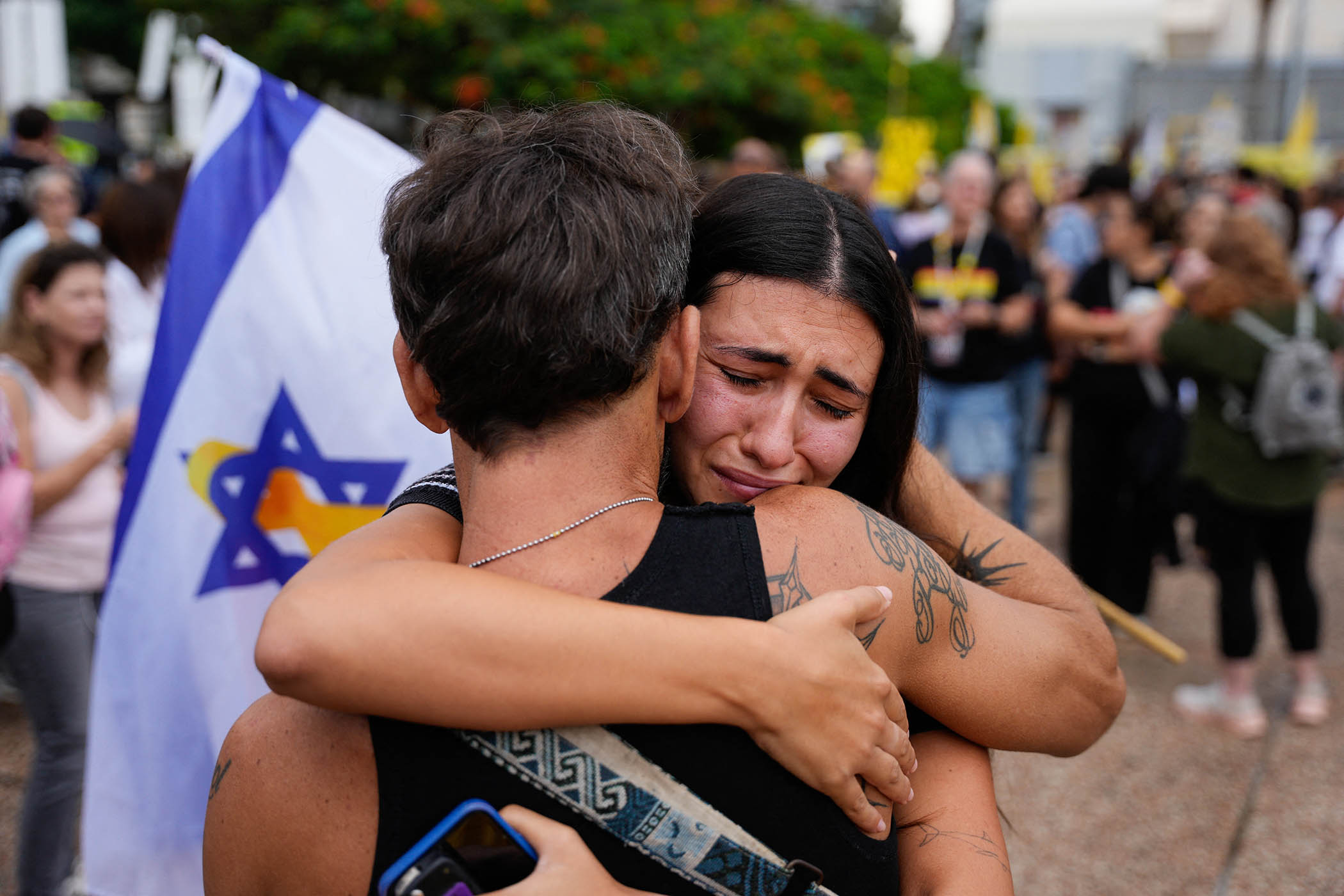 People in Hostage Square, Tel Aviv react to the ceasefire agreement.