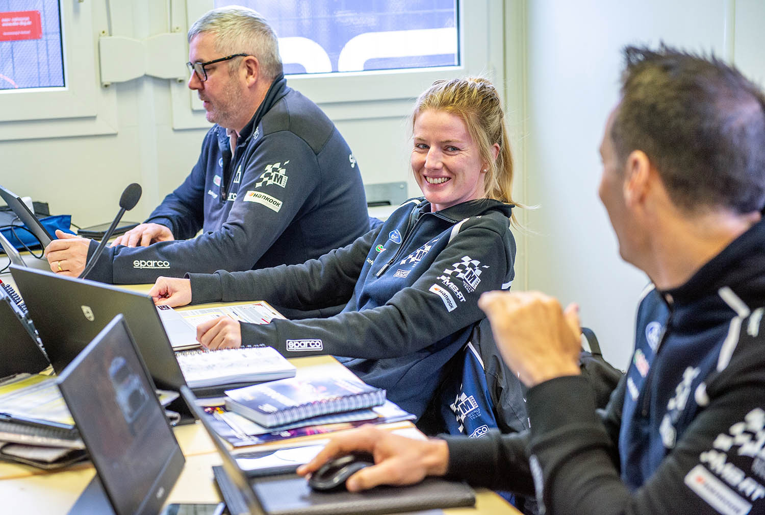 British motorsport engineering company M-Sport coordinator Samantha Gray at her work station with colleagues in the engineers office