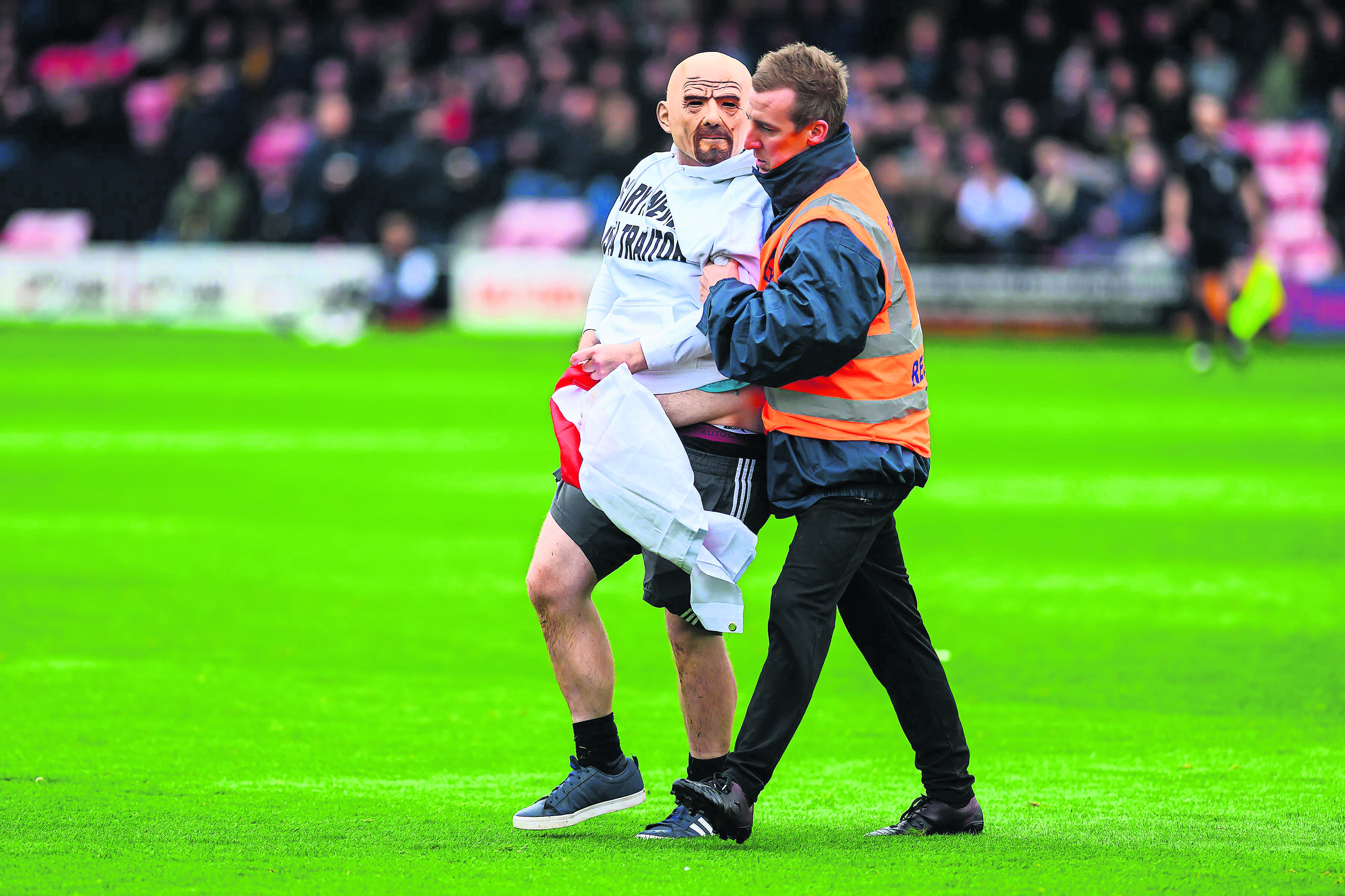 Far-right football supporters in pitch protest over Gary Neville