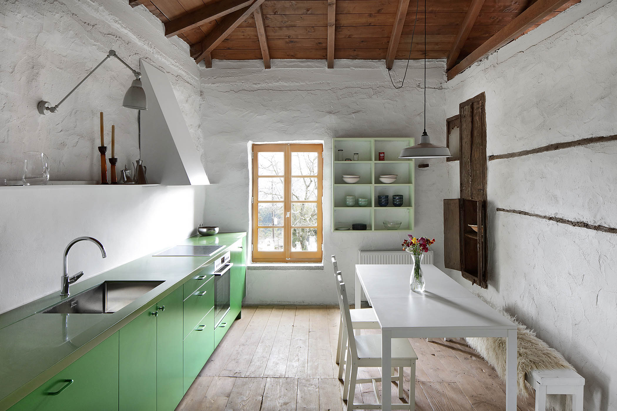 ‘It’s what we learned in the financial crisis. We’re always reclaiming and preserving things, accepting a house in the condition it is. We never say, “This is ugly, horrible”’: the kitchen with restored floors and walls and new units
