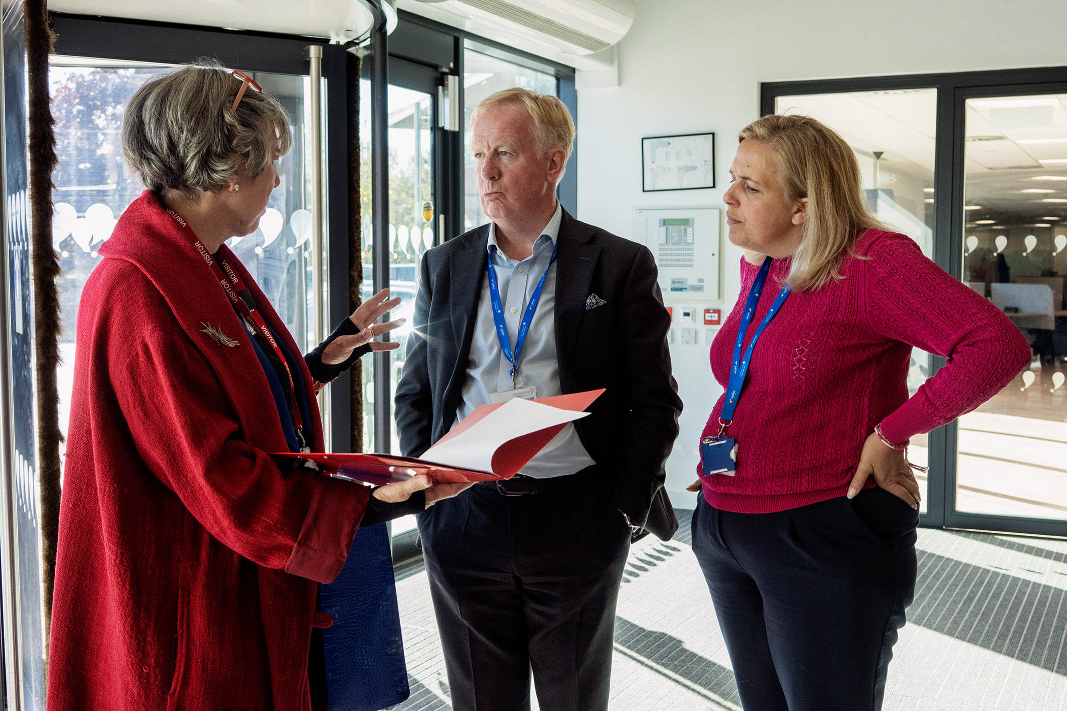 Activist Helen Burnett confronts Anglian Water boss Mark Thurston and a colleague at the company’s headquarters in Huntingdon
