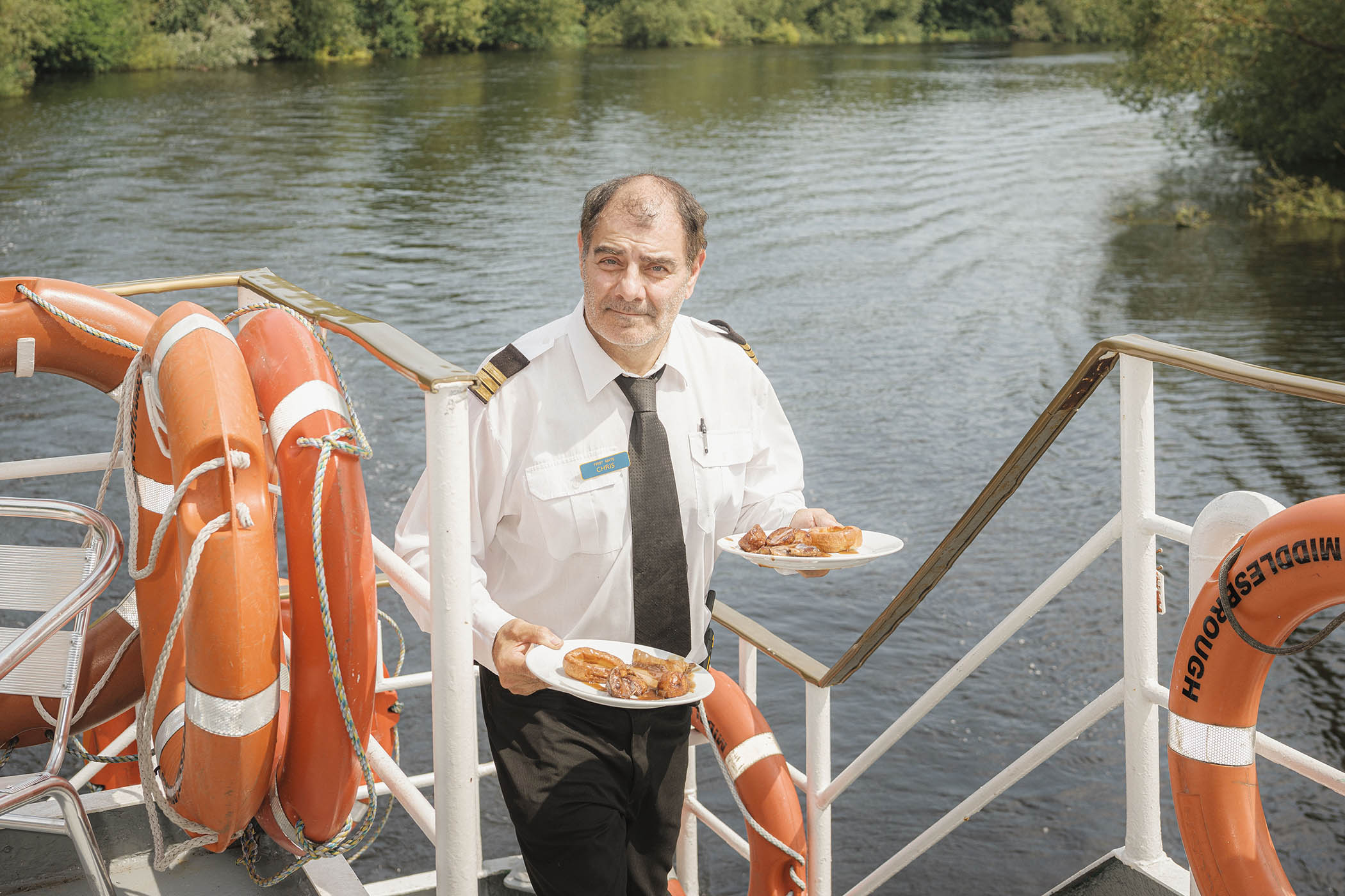 Chris Hughes-Rutherford, DJ and first mate, delivers roast dinners to diners aboard the Teesside Princess. Main image: Jenson Westwood, a waiter on the Teesside Princess, blows balloons before a Taylor Swift-themed party