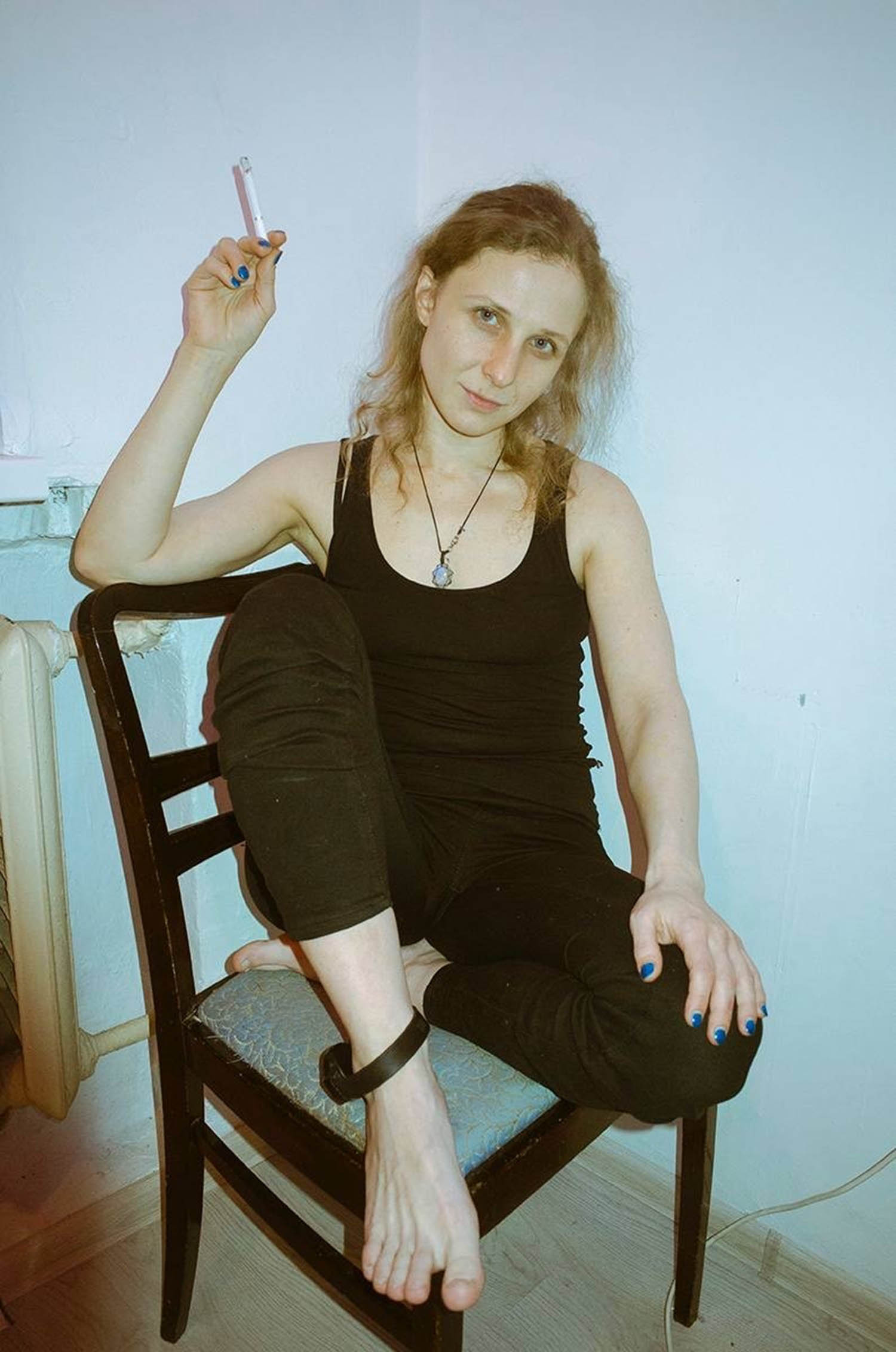 Alyokhina while under house arrest in Russia, pictured with her ankle tag.