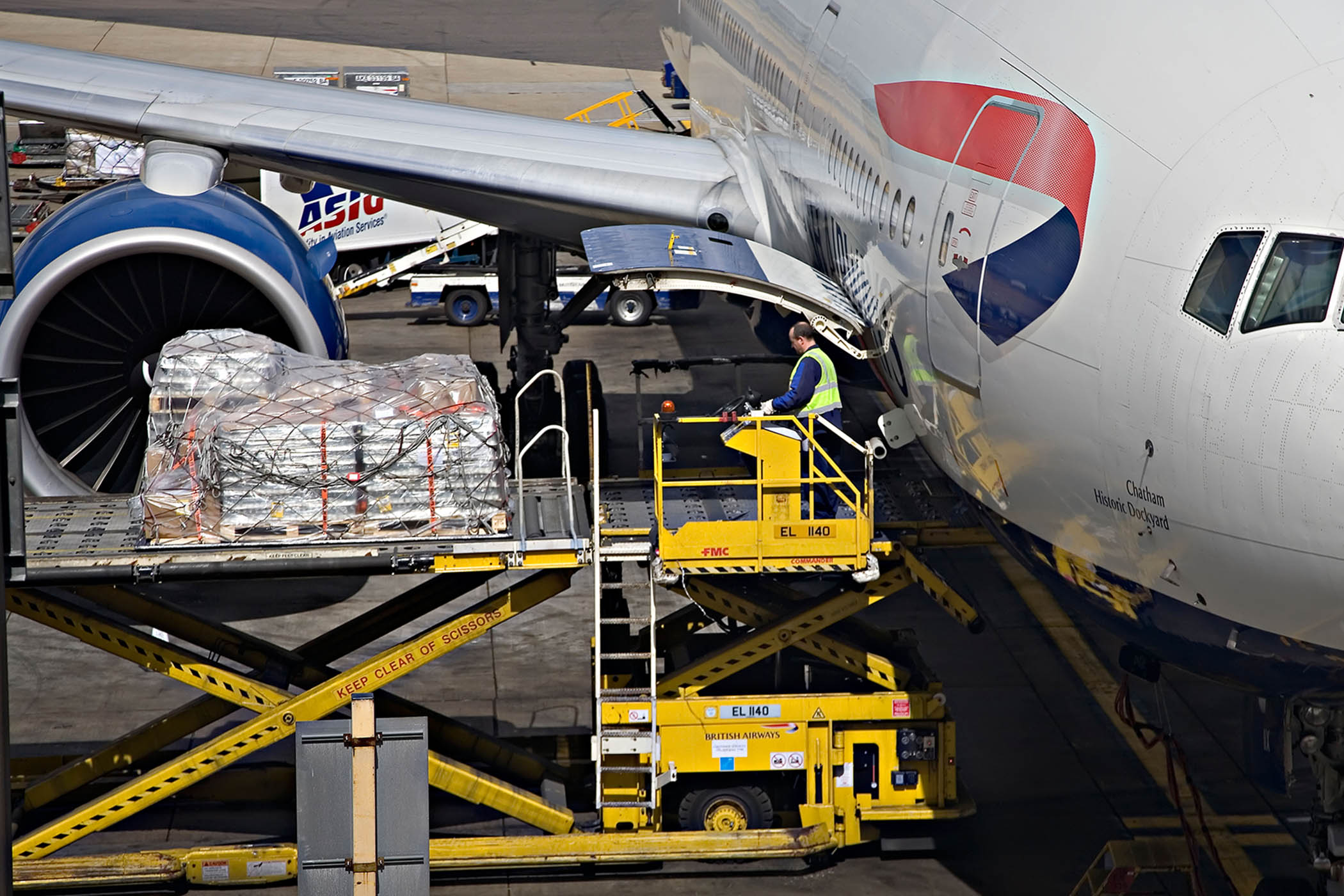 Cargo is loaded on to a plane at Heathrow airport.