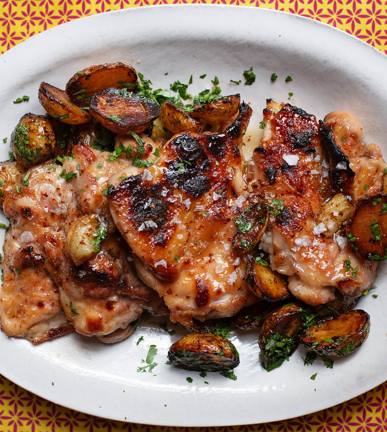 Glaze of glory: grilled chicken thighs with a sticky miso and honey marinade, served with lemon and soy potatoes