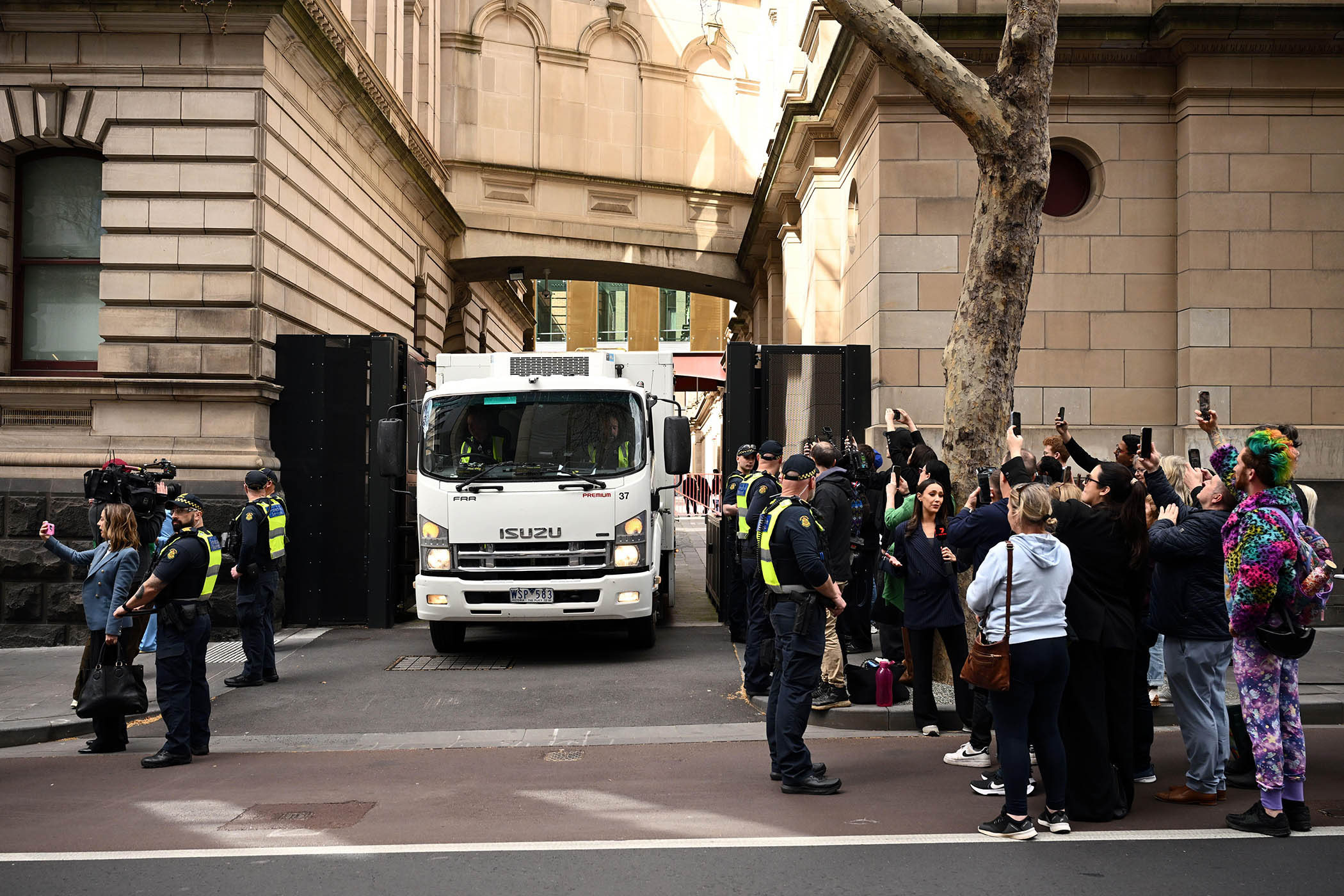 A prison vehicle carrying Patterson leaves a Melbourne court in September