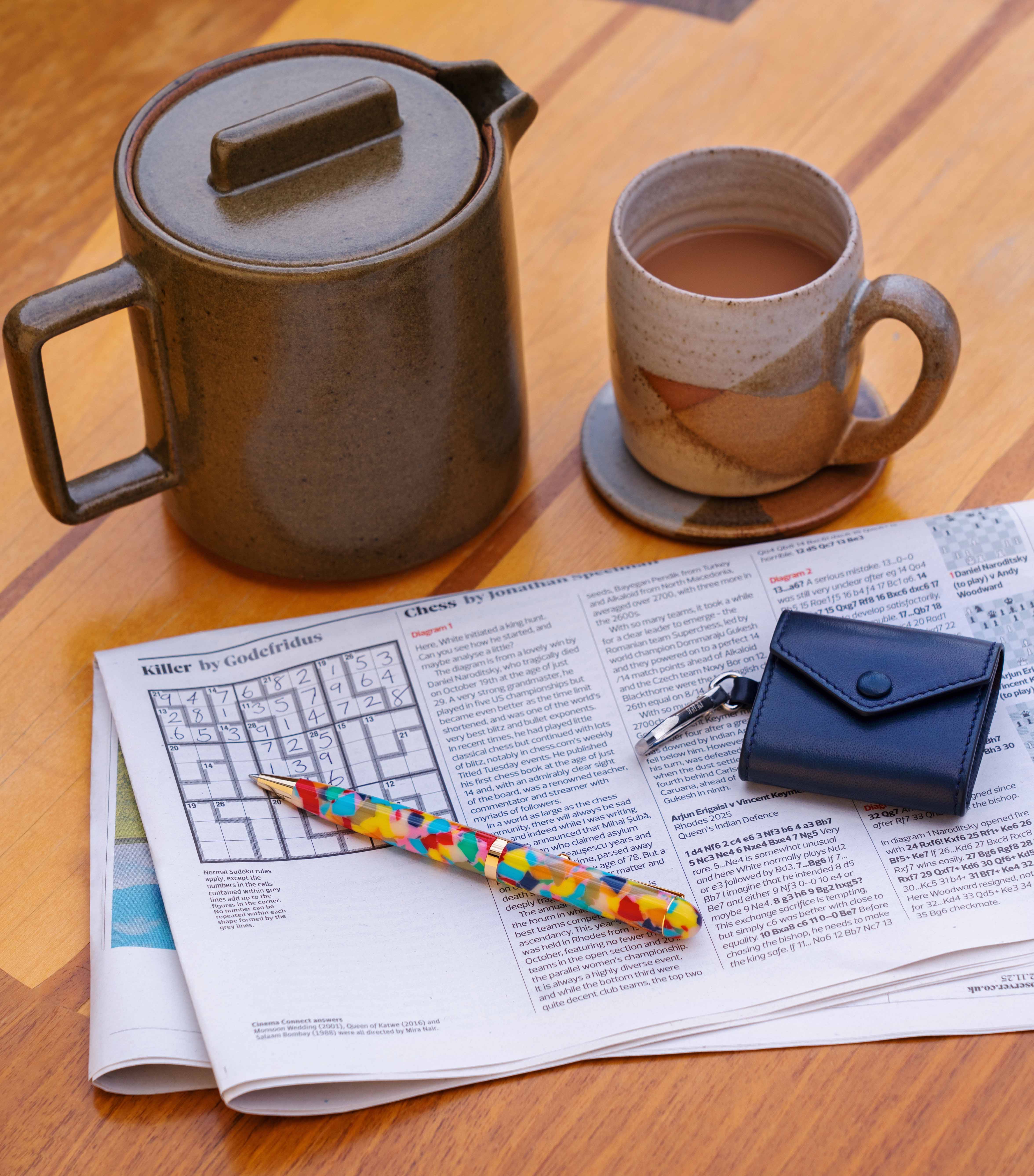 Tea pot, £85, mug, £32, and coaster (part of a set), £28, all Toast. Ballpoint pen, £95, Choosing Keeping. AirPods case, £390, Métier