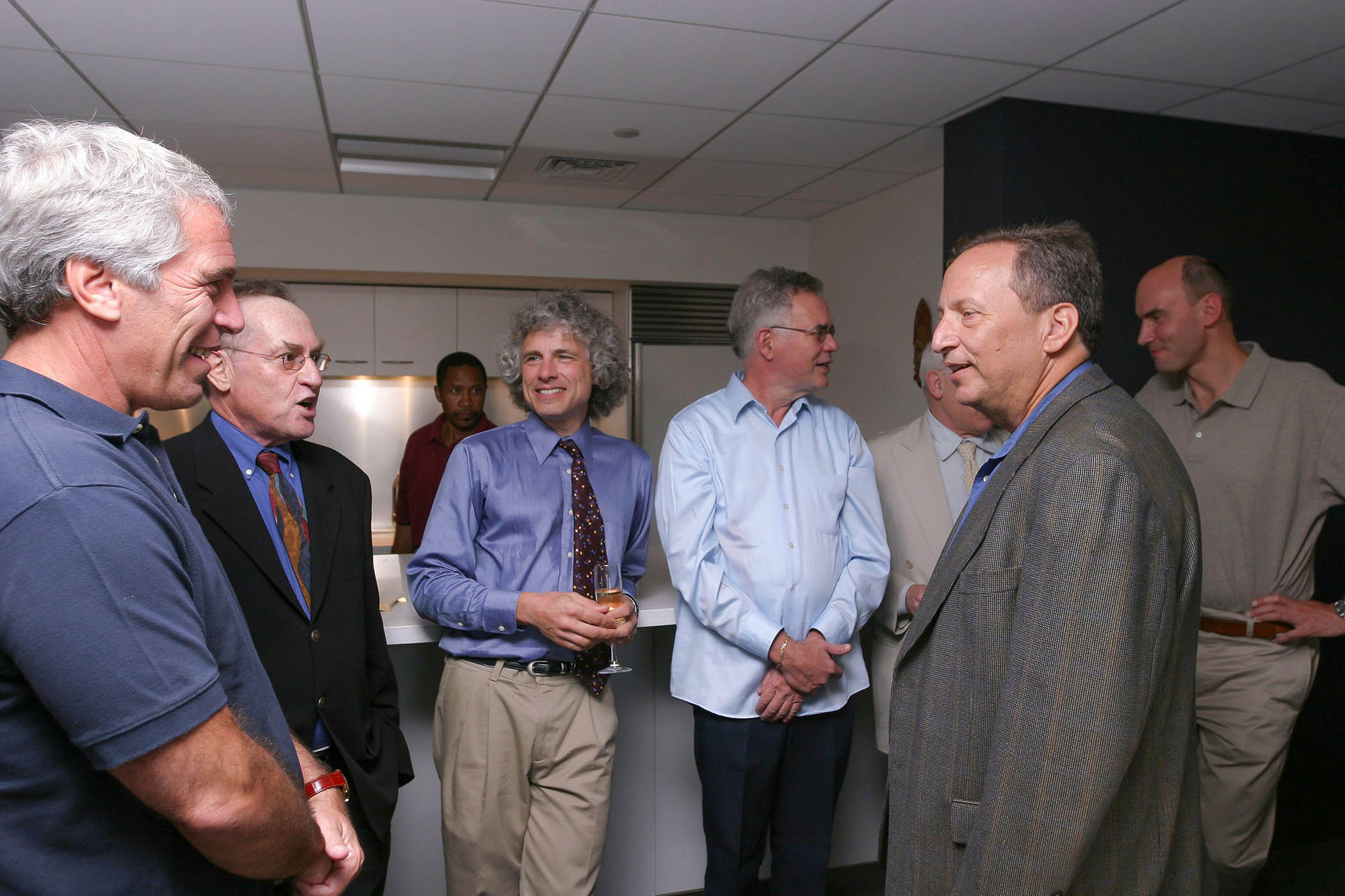 Jeffrey Epstein at a dinner he hosted at Harvard University in 2004 with professors Alan Dershowitz and Steven Pinker, American evolutionary biologist Robert Trivers, Larry Summers and Martin Nowak. Pinker was not mentioned in the recent tranche of emails