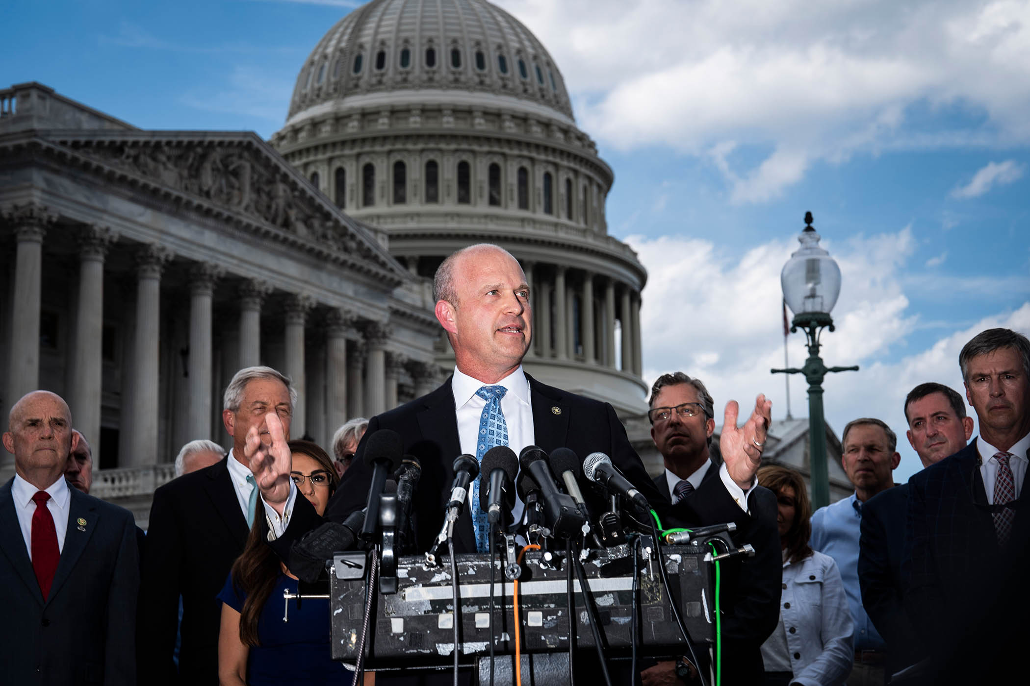 Kevin Roberts, president of The Heritage Foundation, speaks with members of the conservative House Freedom Caucus during a news conference on Capitol Hill