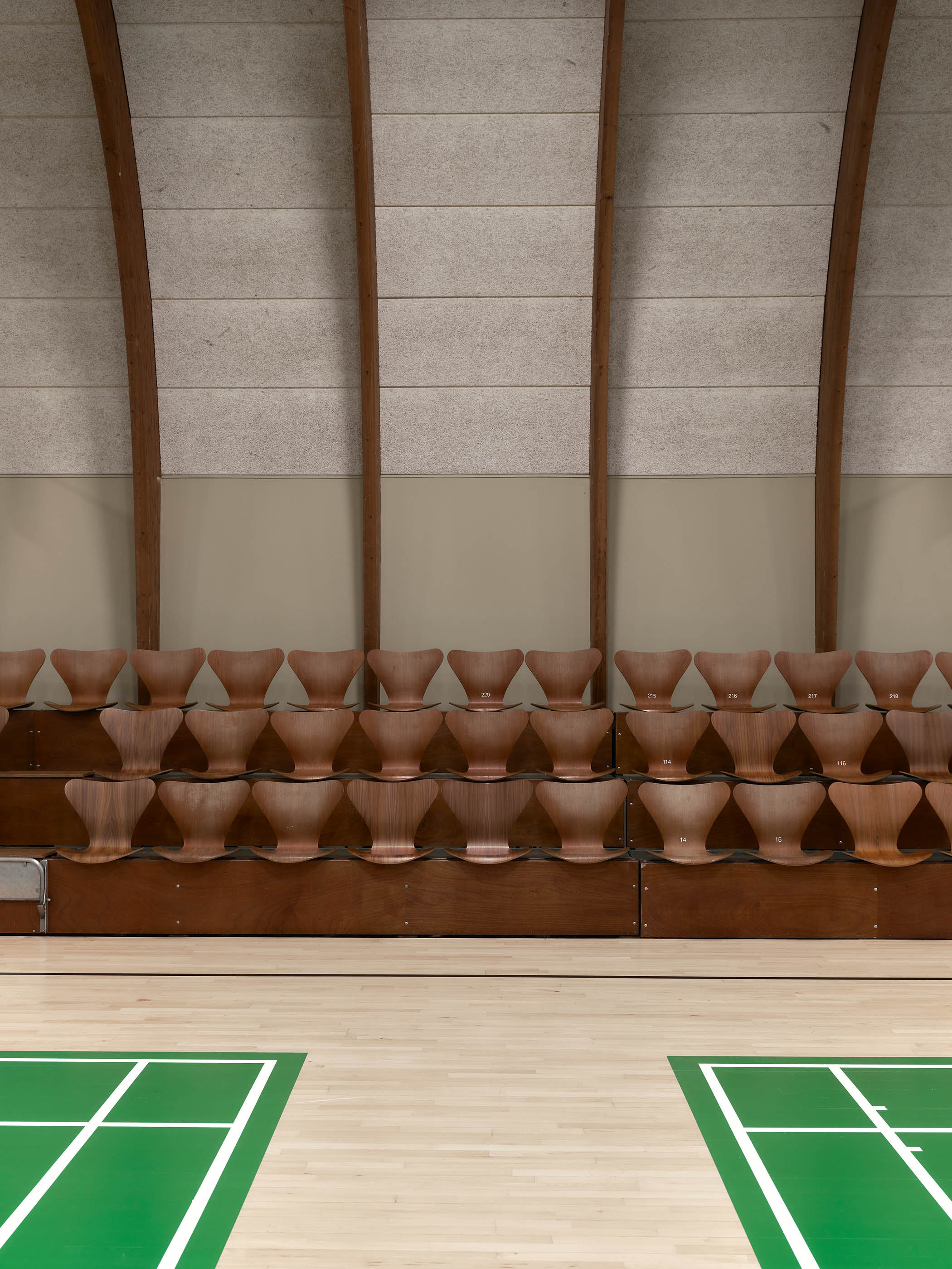 Unbeatable design: the walnut-finished chairs are for spectators, with 12 black ones for line judges