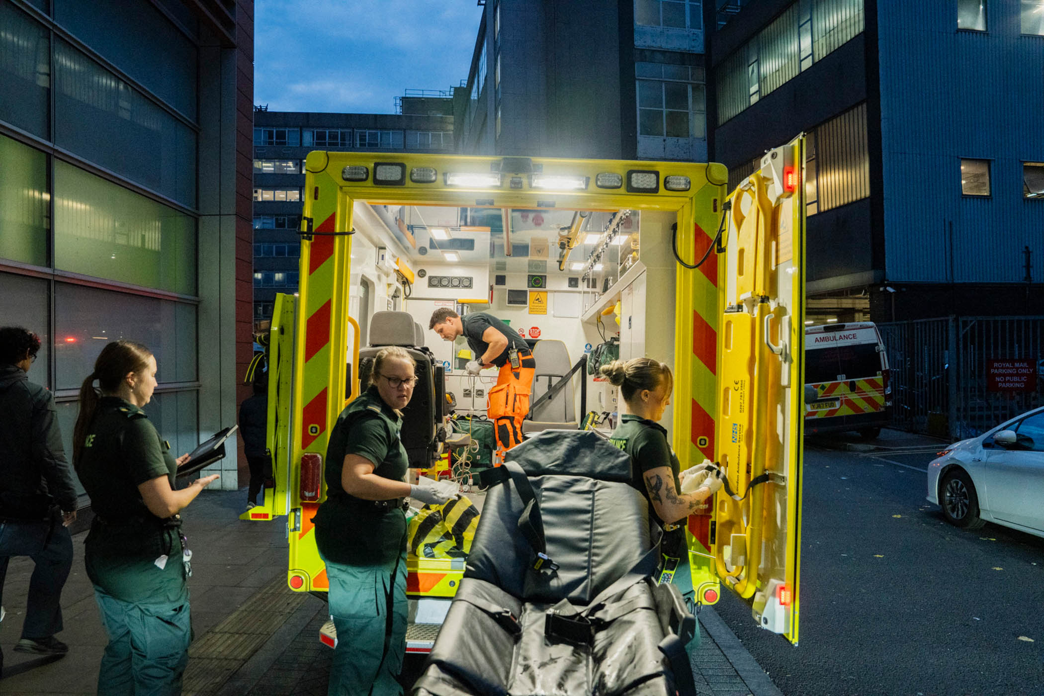 After taking the patient to hospital, the team cleans the ambulance in preparation for the next call