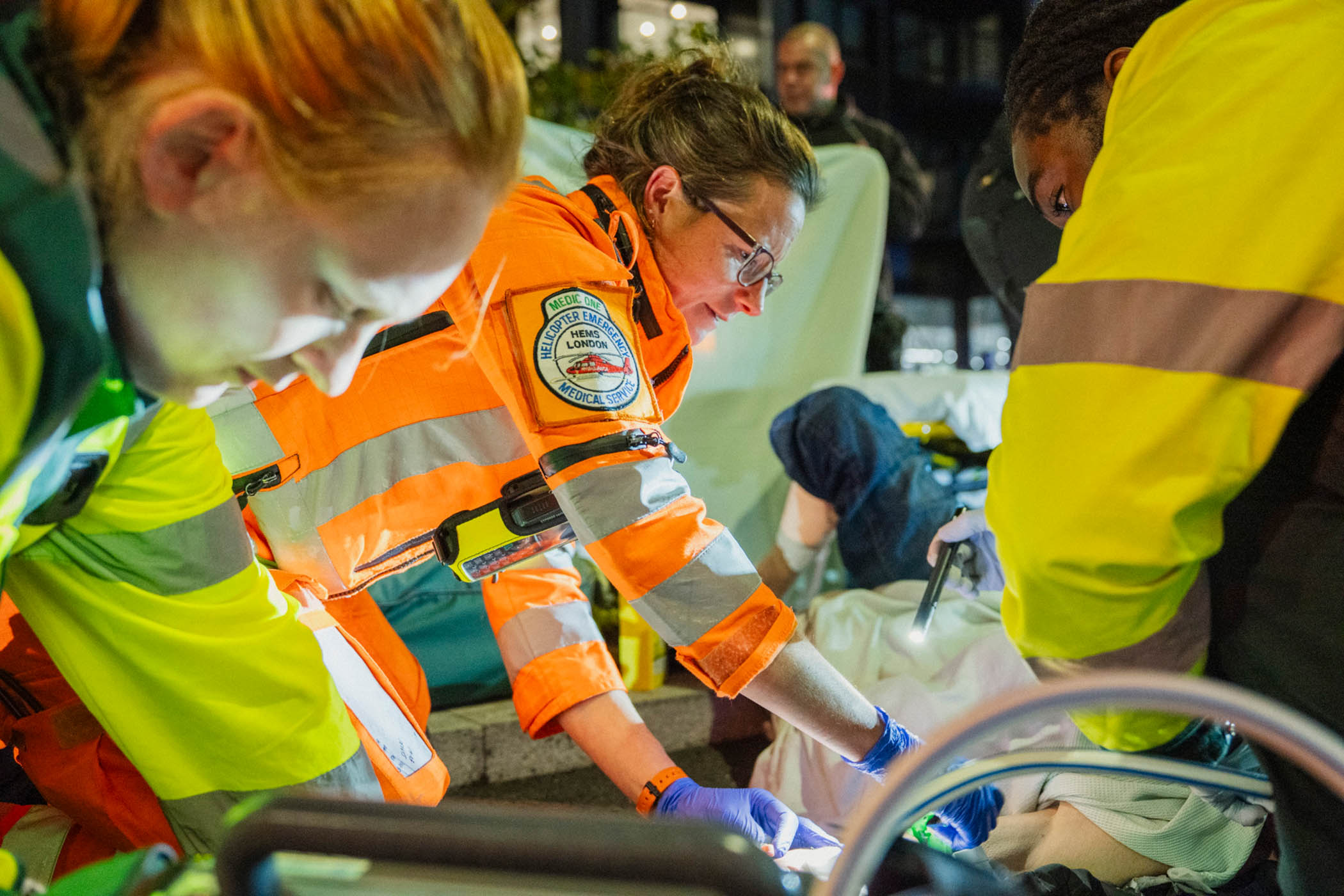 Flora Bird, an expert in brain injuries, tends to a patient who has fallen off his motorbike