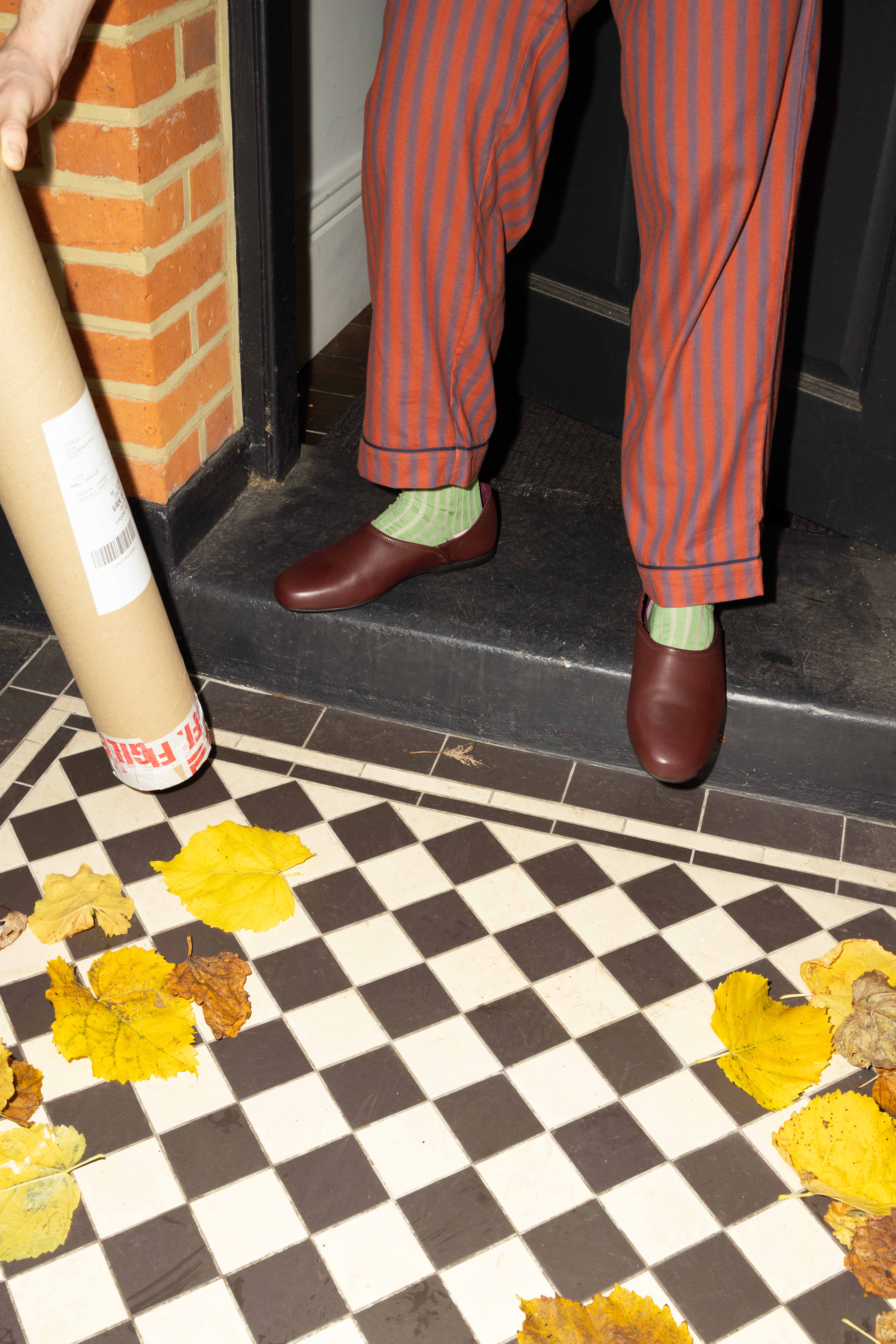 Please leave on doorstepBlurred stripe pyjama bottoms, £38, Chelsea Peers. Geranium socks by Michael Fisher, £18, London Sock Company. Harston leather slippers, £50, Clarks