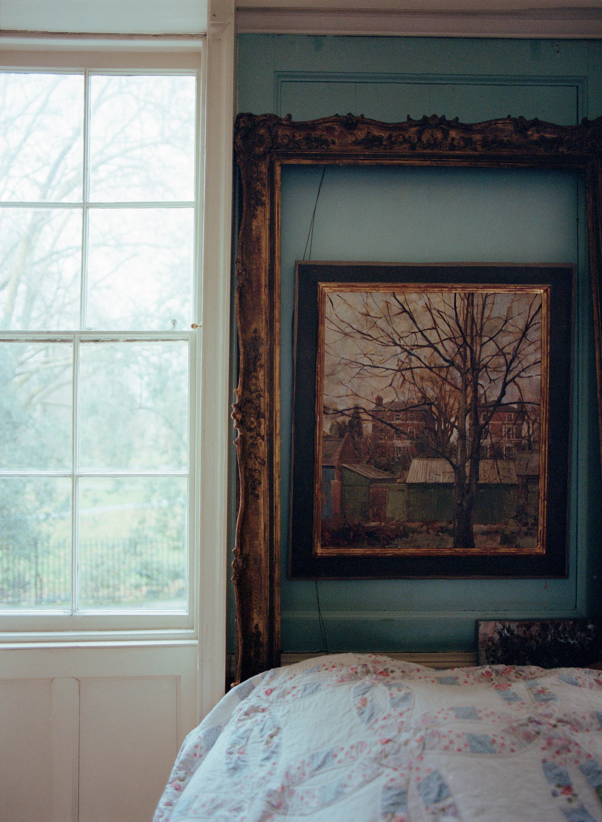 The bedroom, with its sky blue panelling on the walls