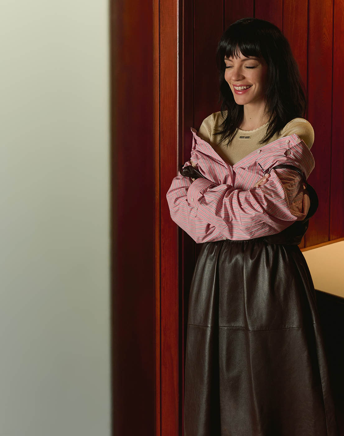 Leather dress, poplin shirt dress and ribbed knitwear, all by Miu Miu