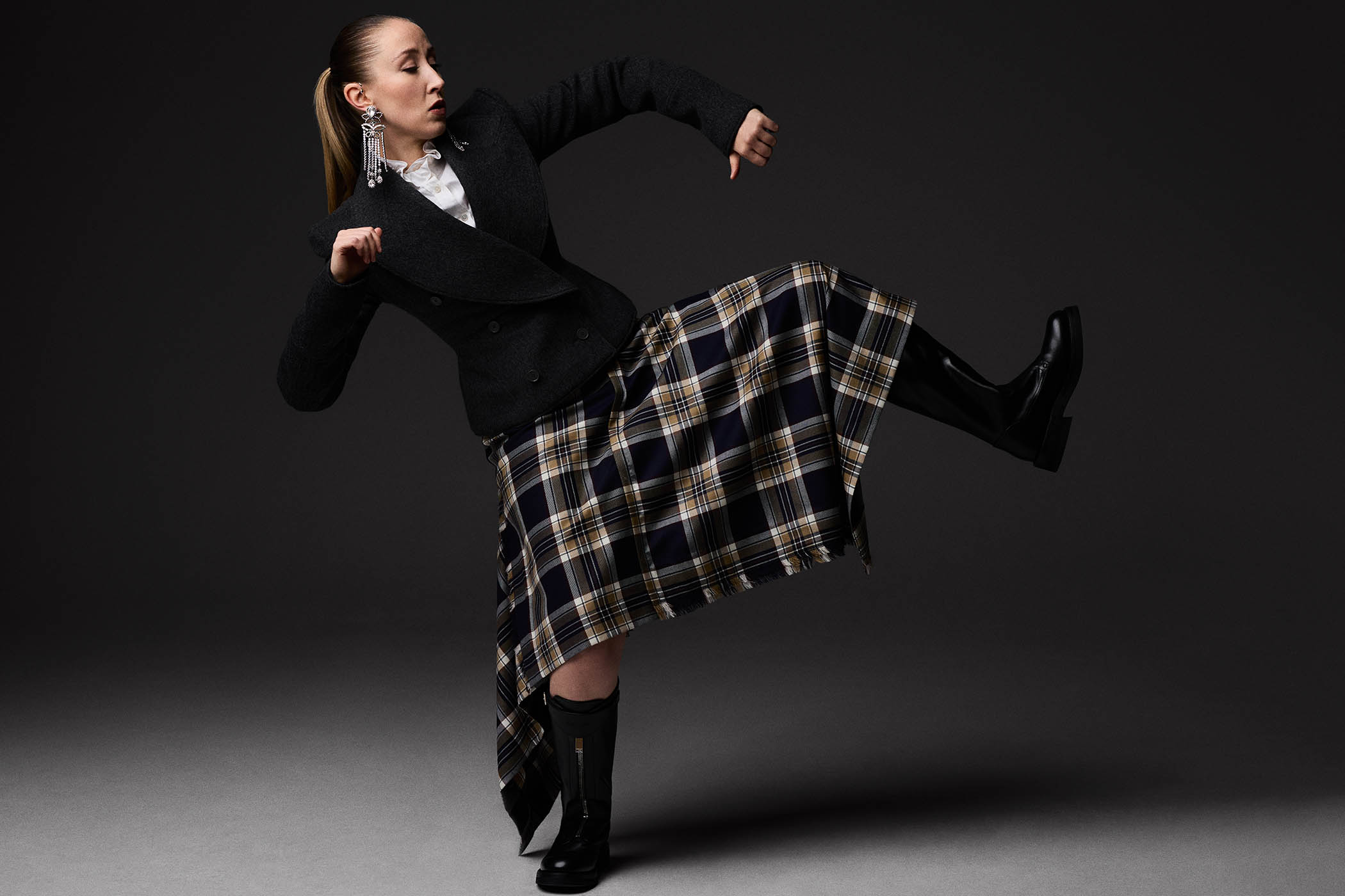 Double-breasted peacoat, shirt, draped tartan kilt, chandelier earrings and countryside boots, all by McQueen