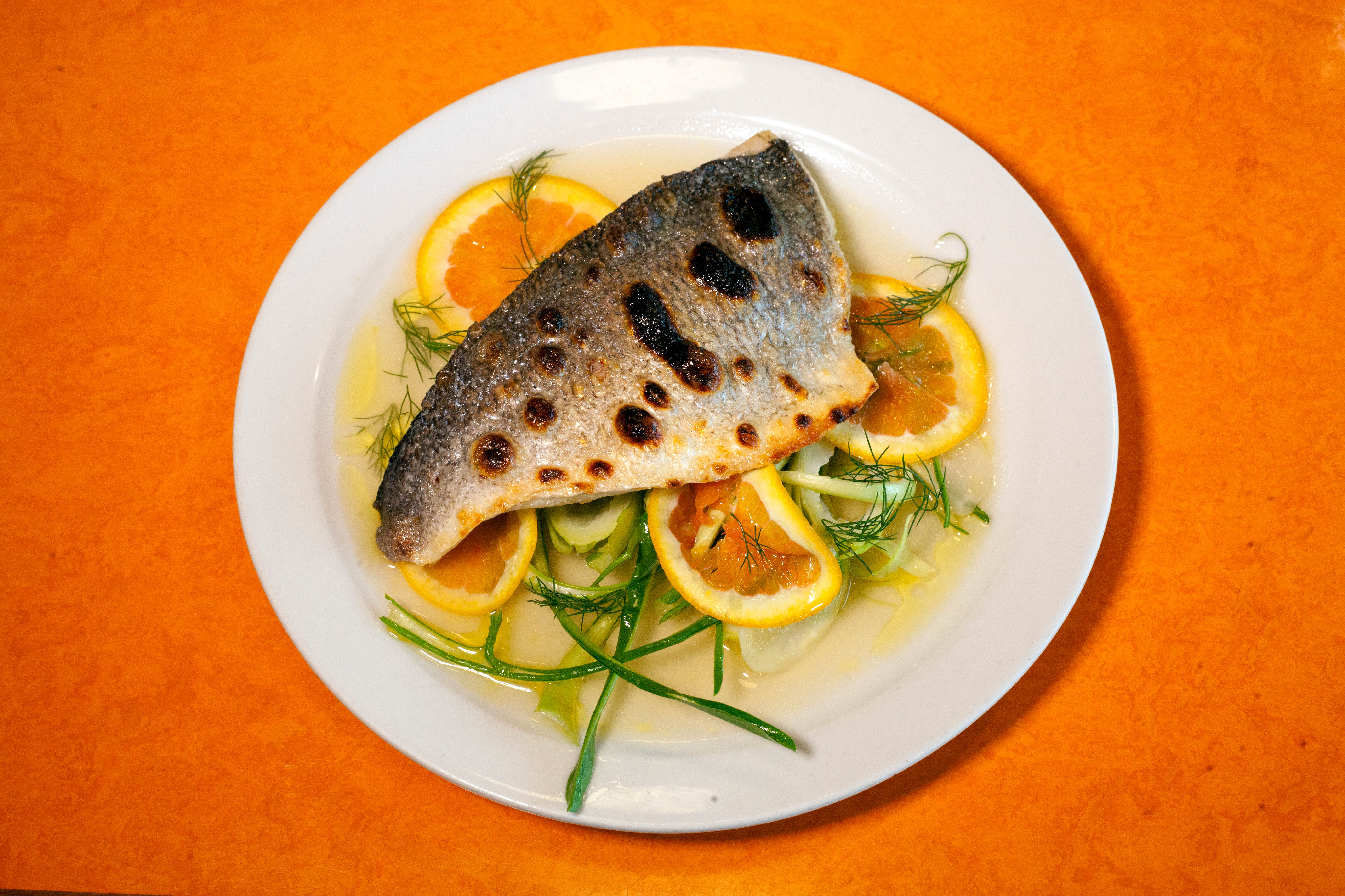 ‘I would have relished it if I had not felt a self-inflicted obligation to gobble it up rapidly’: sea bream, puntarelle, citrus and fennel