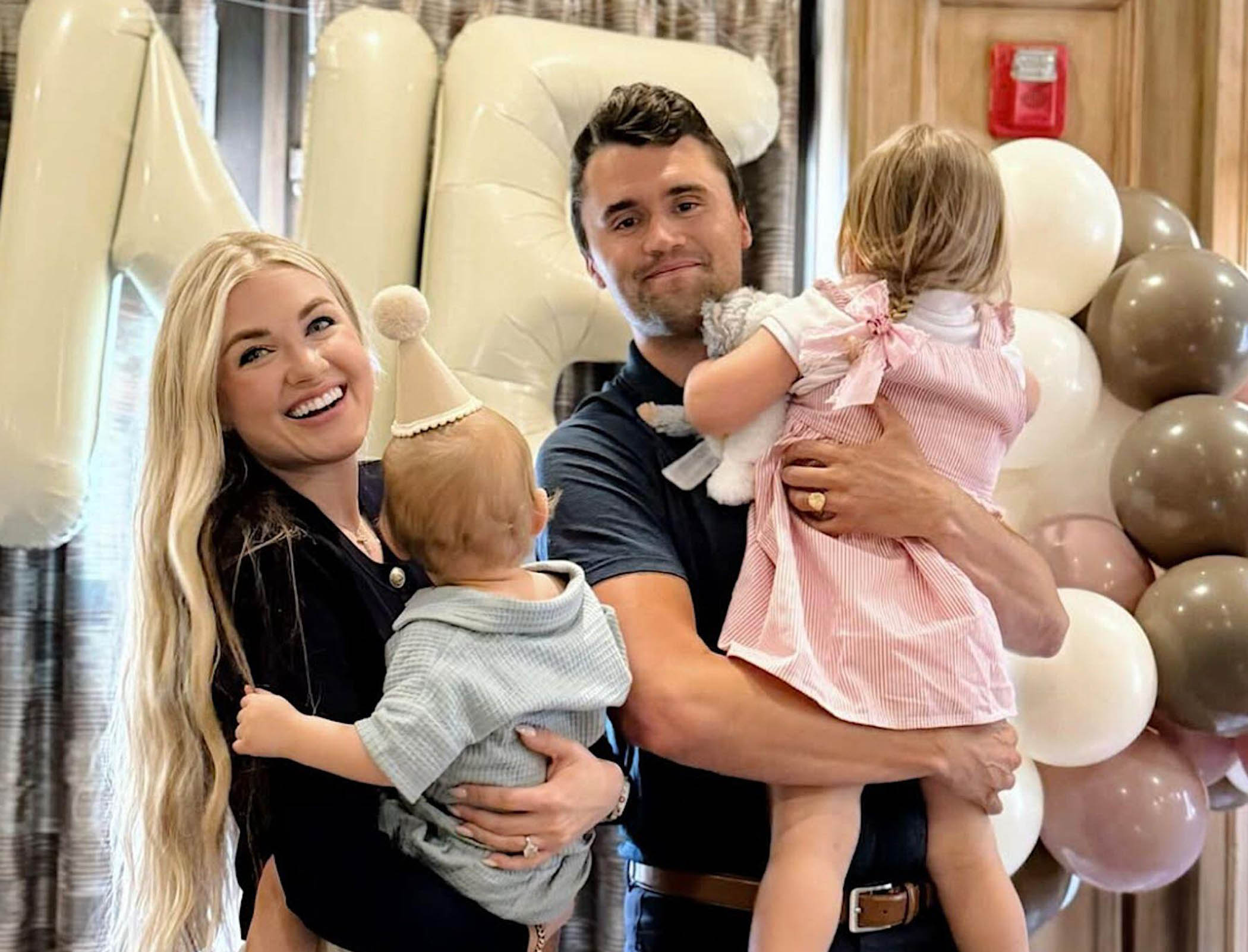 Erika Kirk with her late husband Charlie and two children