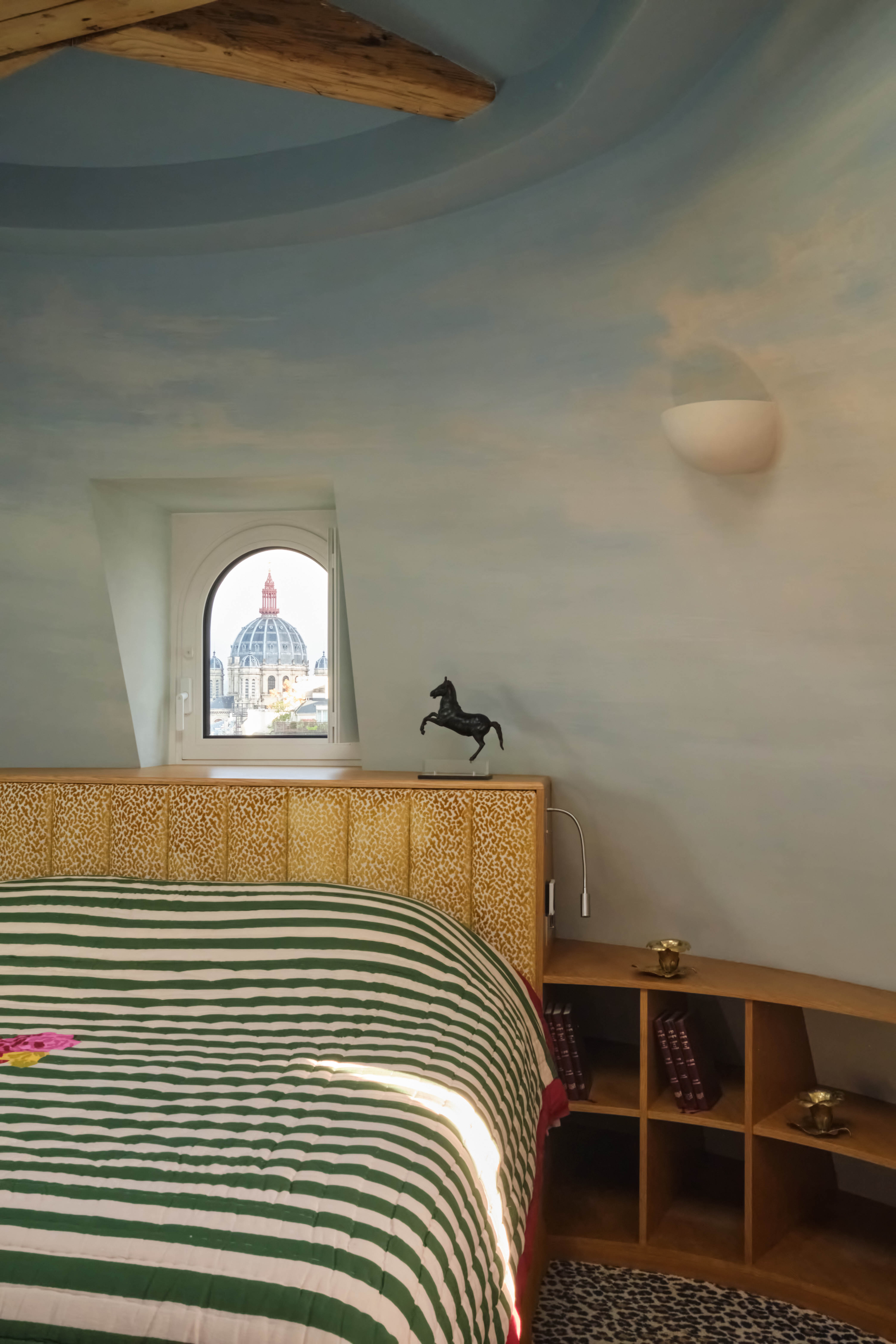 The master bedroom, in the rotunda, with its painted sky ceiling