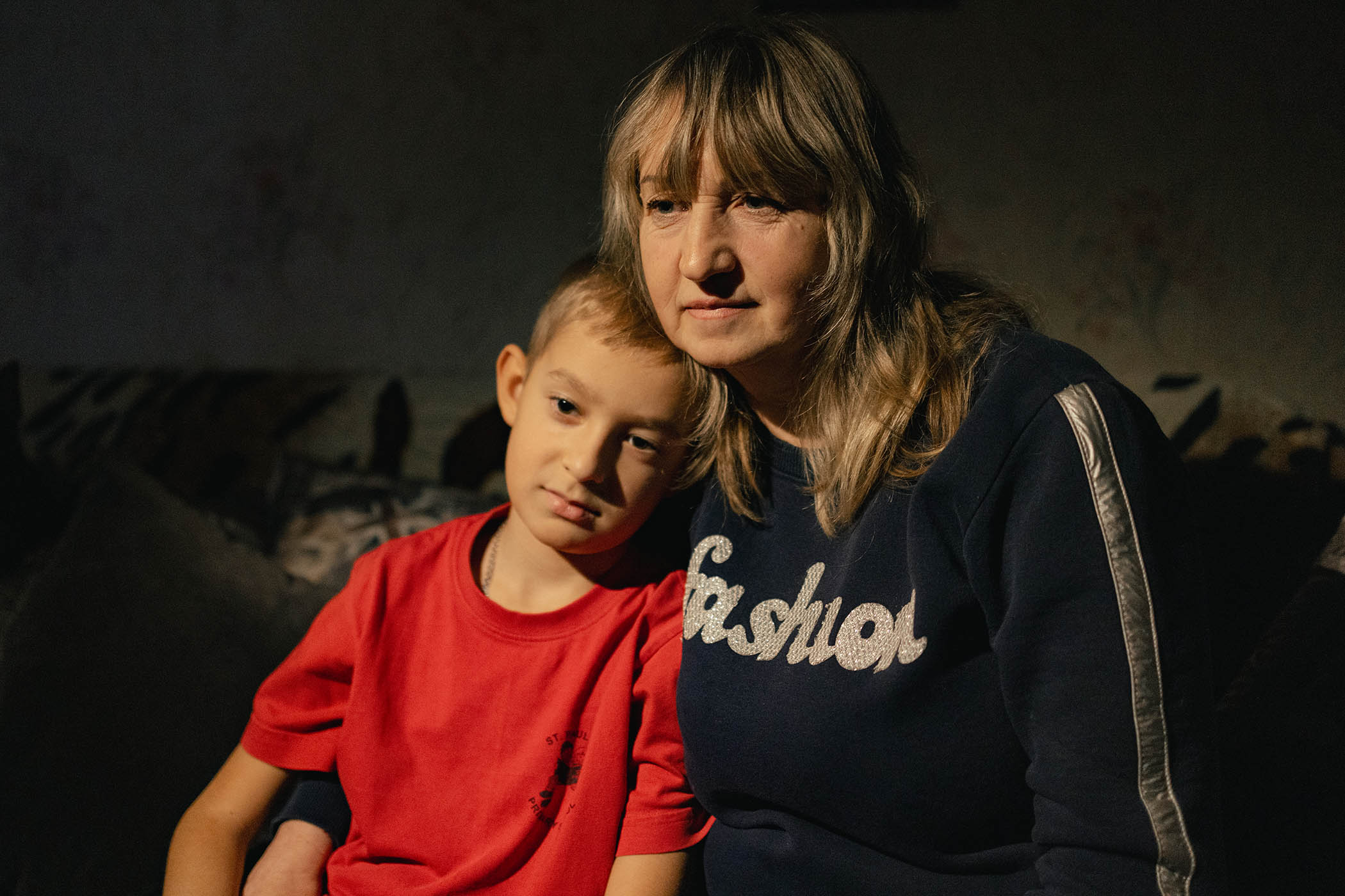 Viktoria with her son Oleksandr at their home in Sloviansk.