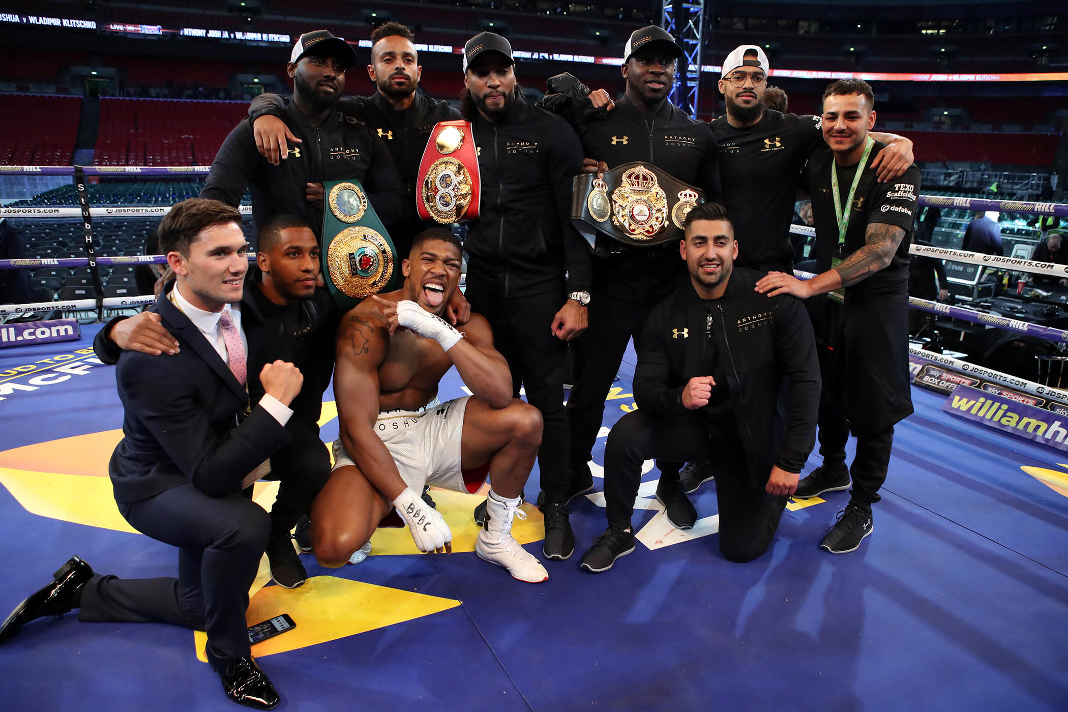 Anthony Joshua with his training team after the 2017 heavyweight world title bout against Wladimir Klitschko at Wembley Stadium