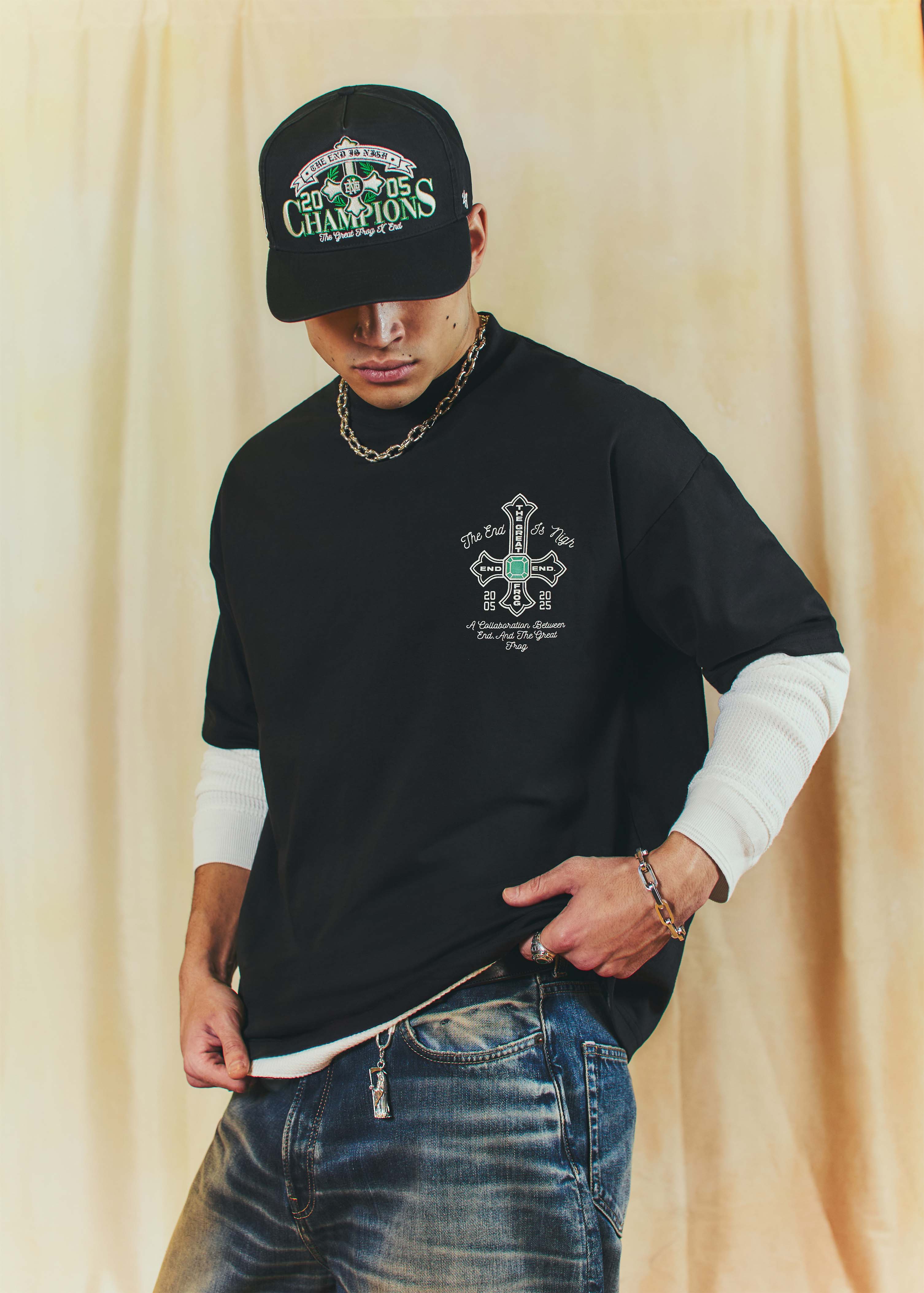 The End is NighEnd is celebrating its 20th anniversary by unveiling a collaboration with London jewellery institution The Great Frog. At the heart of the collection is a chunky sterling-silver ring, set with a green gemstone and ‘The End Is Nigh’ engraving. The ring is joined by a Grim Reaper keyring and five apparel pieces that blend college-style sportswear with The Great Frog’s gothic DNA – including a varsity jacket, hockey jersey, snapback, hoodie, and t-shirt. £45 to £950, End.