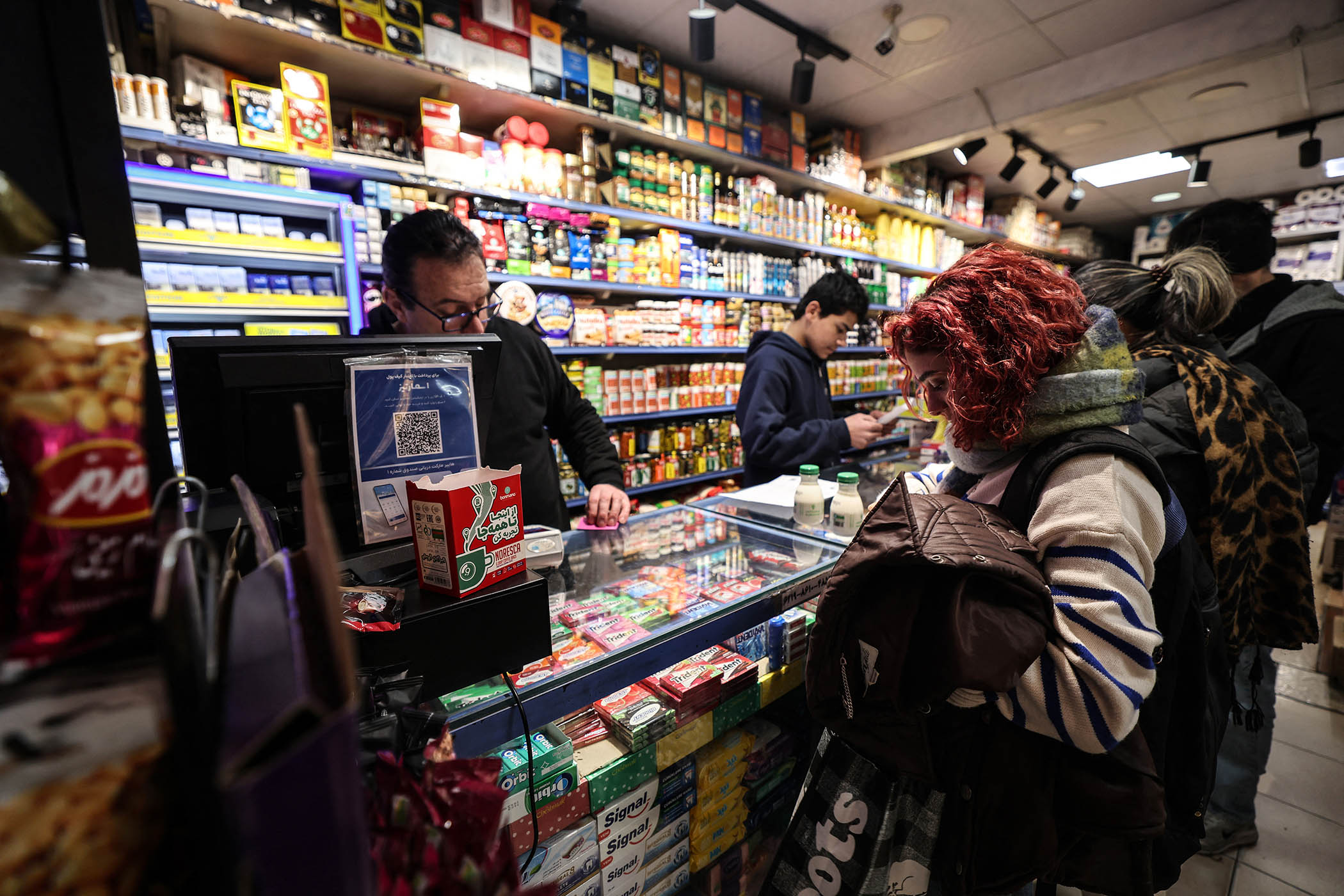An Iranian woman shops in Tehran on 7 January