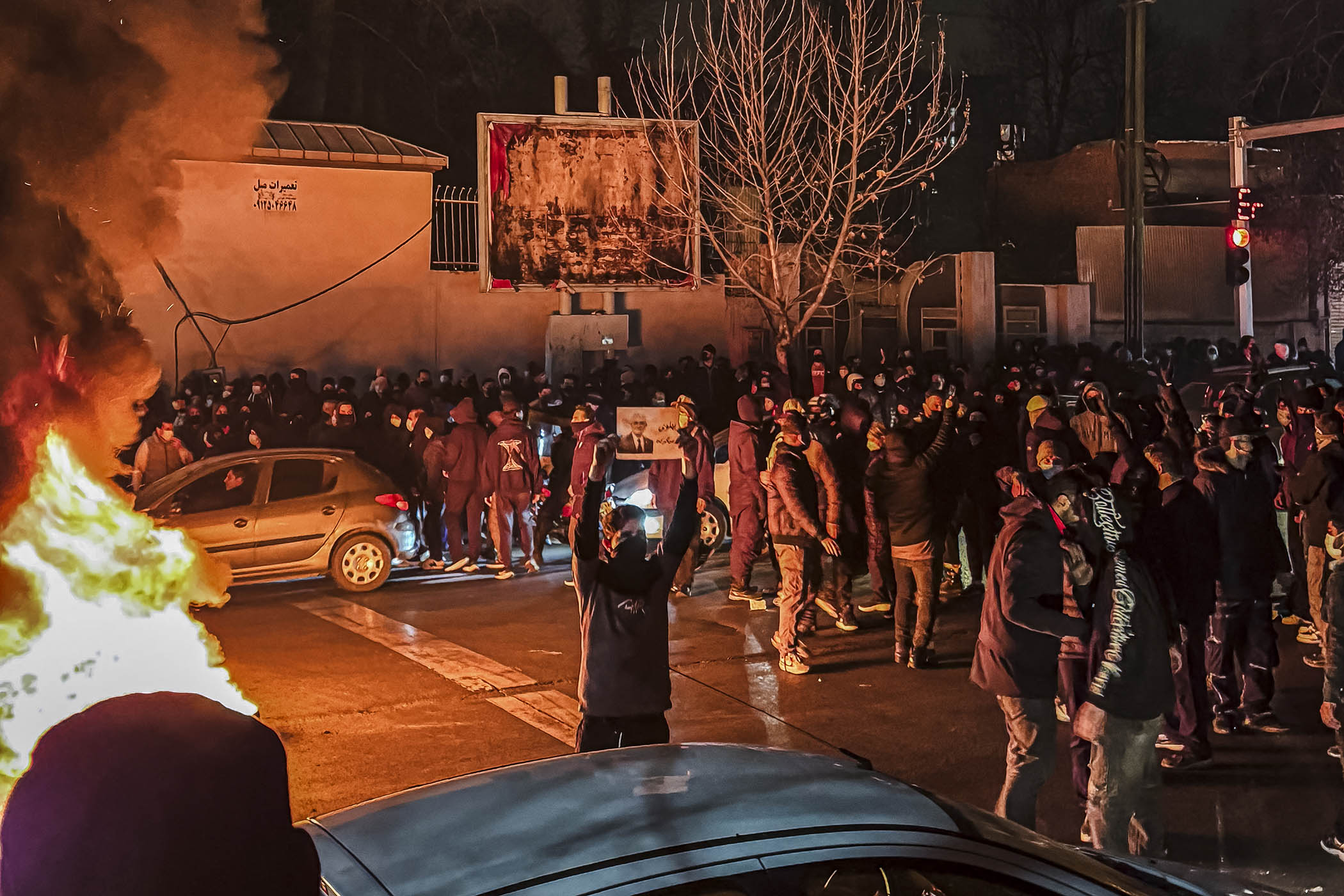 Iranians block a street during a protest in Tehran, Iran, on 9 January