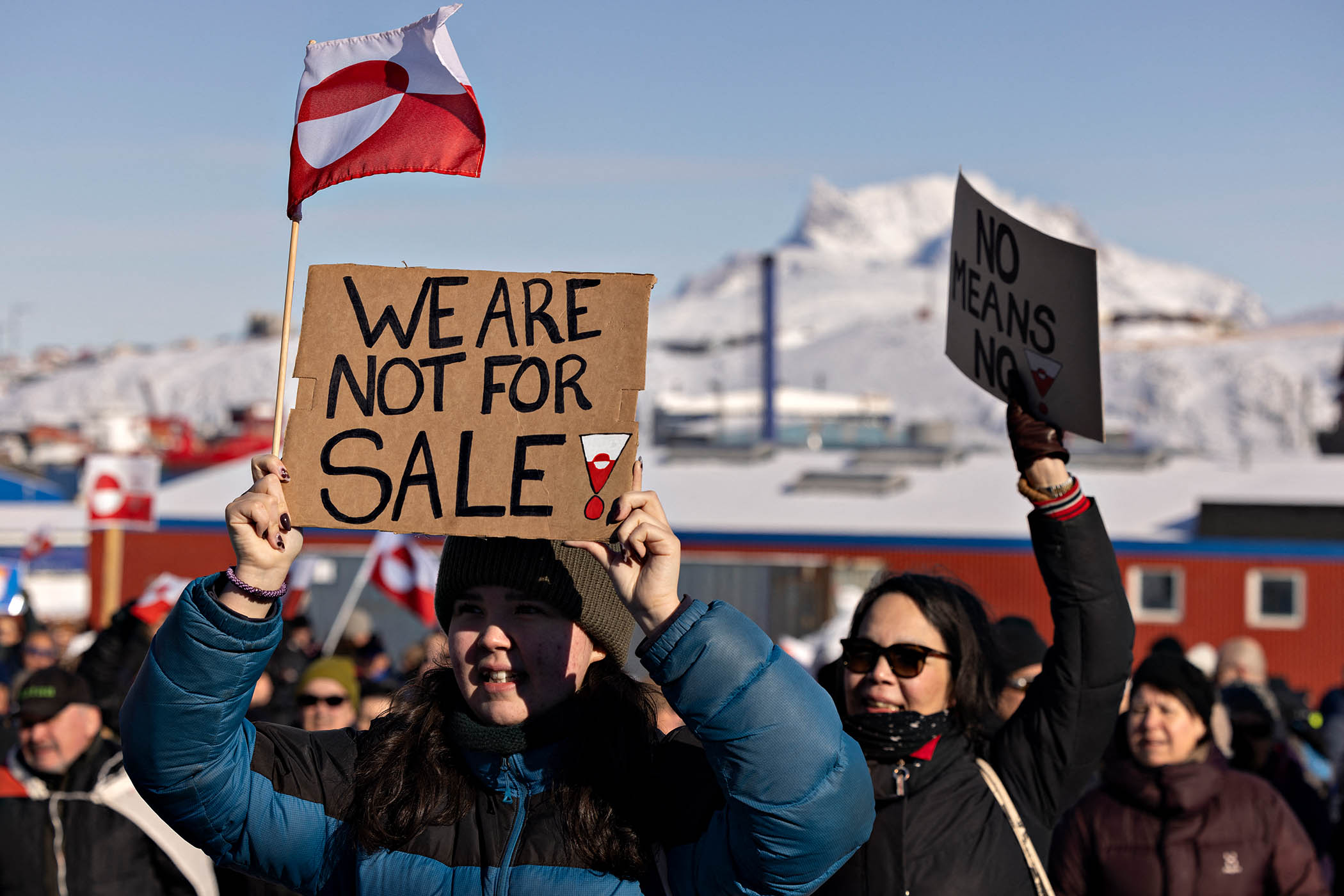 A protester holds a sign reading 'We are not for sale' in front of the US consulate during a demonstration, under the slogan 'Greenland belongs to the Greenlandic people', in Nuuk, Greenland, on March 15, 2025. 