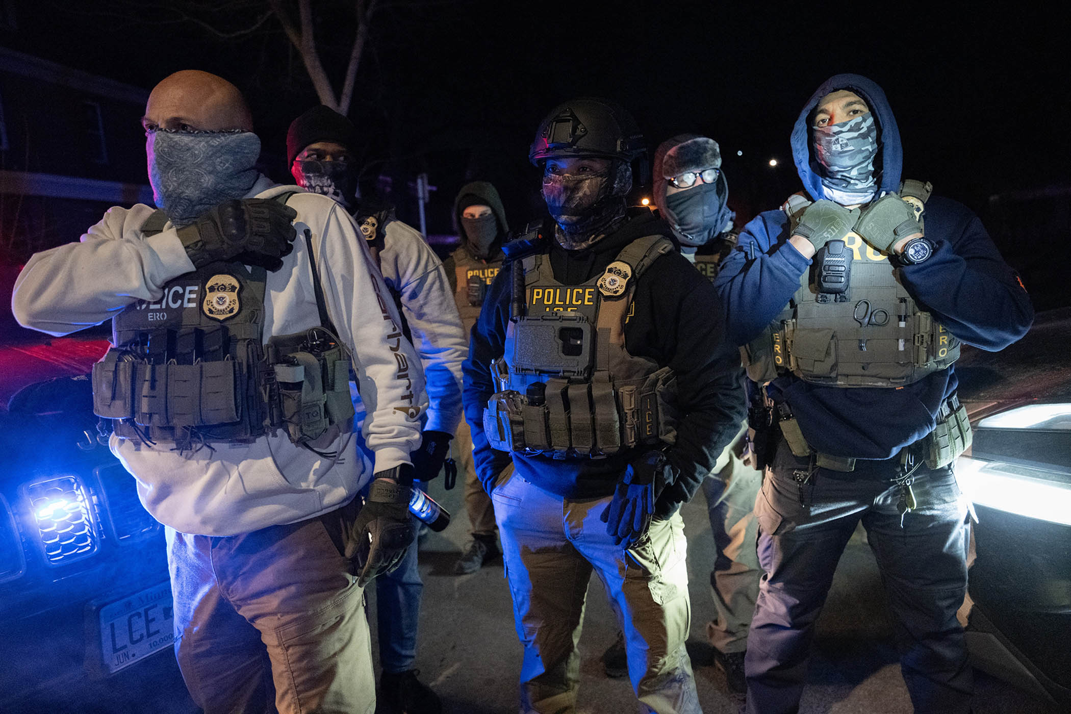 ICE agents during a confrontation with residents following a shooting in Minneapolis on 14 January