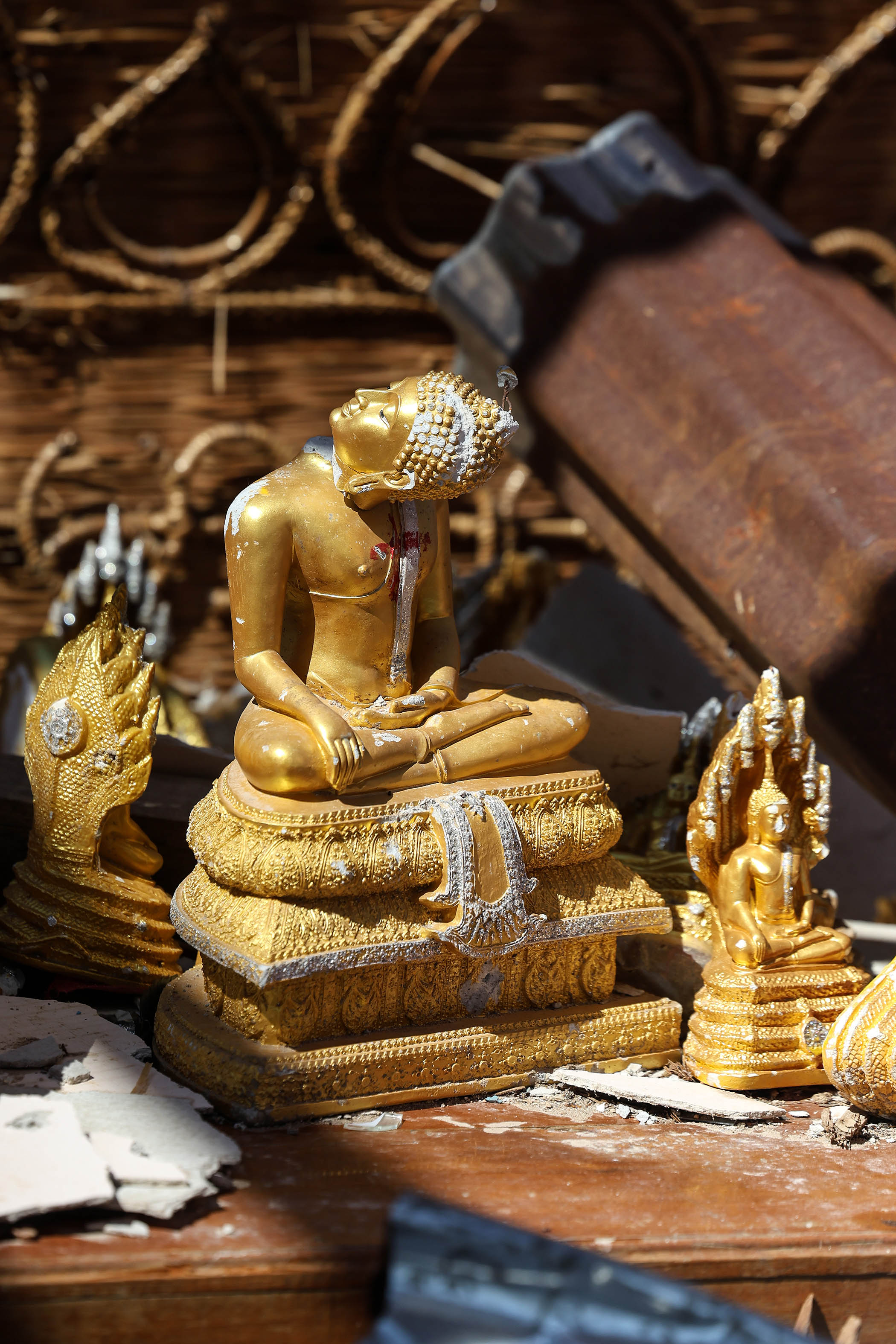 A Buddha statue at a temple damaged during clashes between the Myanmar military and resistance fighters in Mawdaung